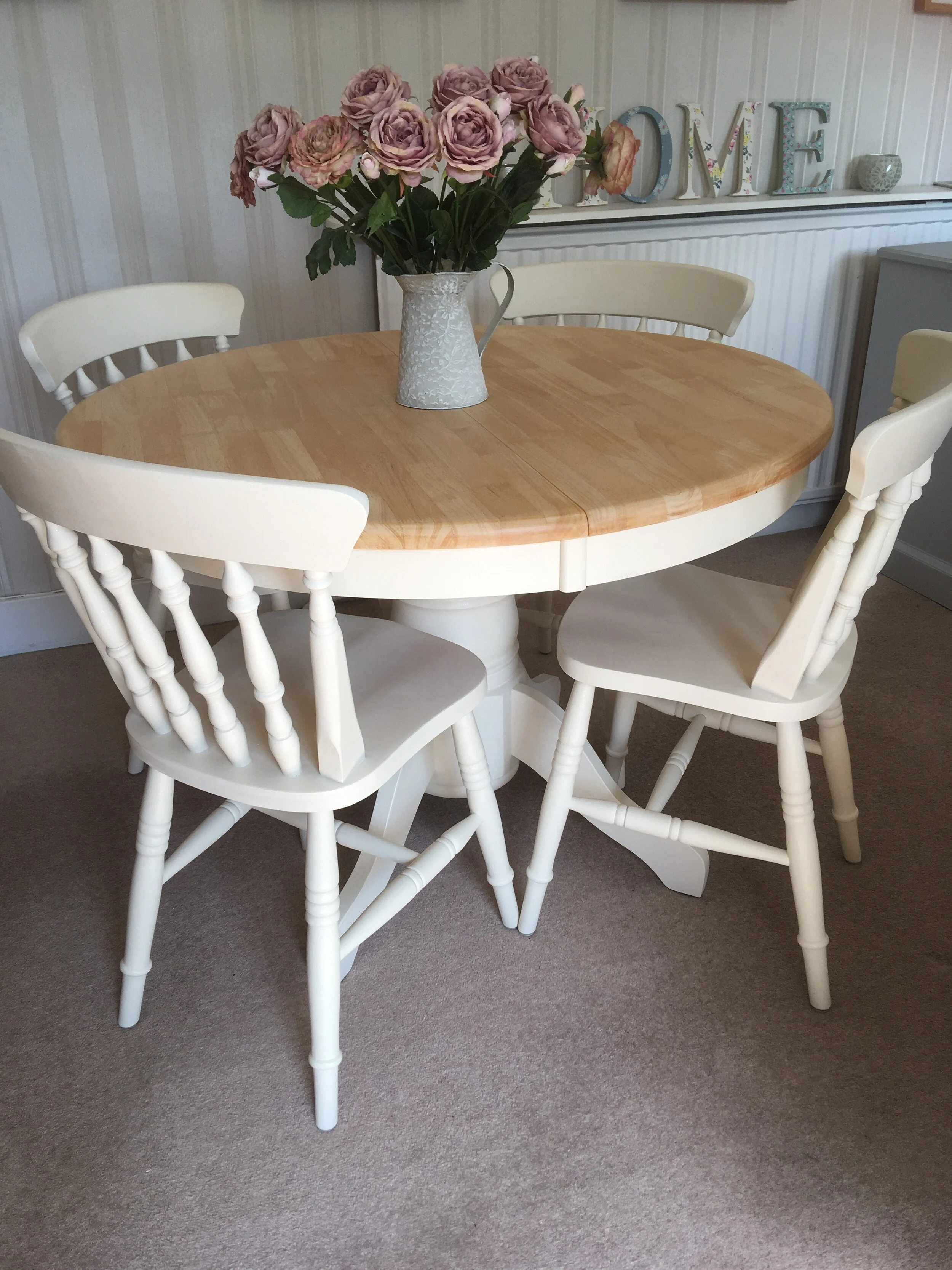 cream round extendable table and chairs