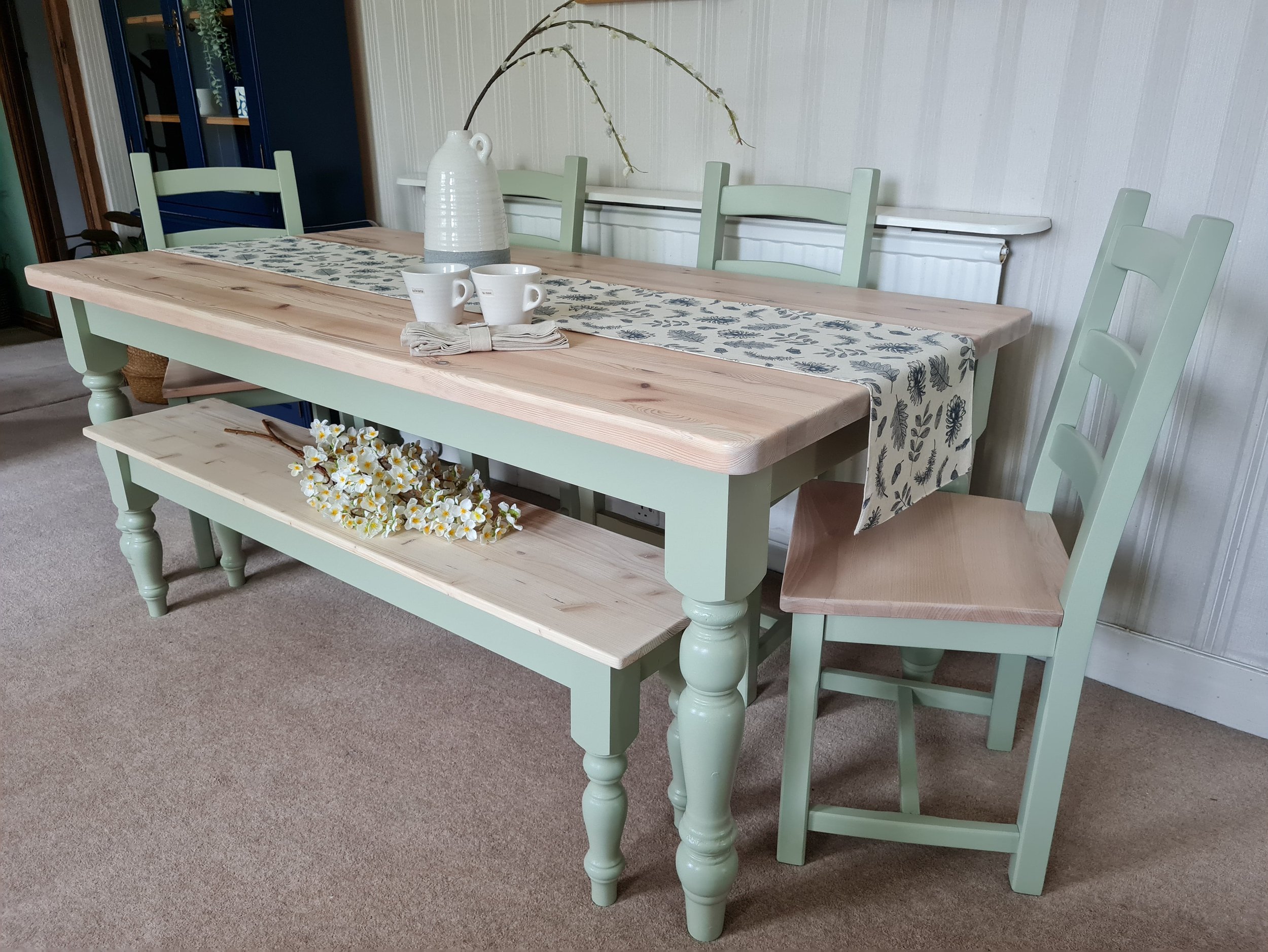 sage green painted farmhouse table and bench set with light wooden natural toned top