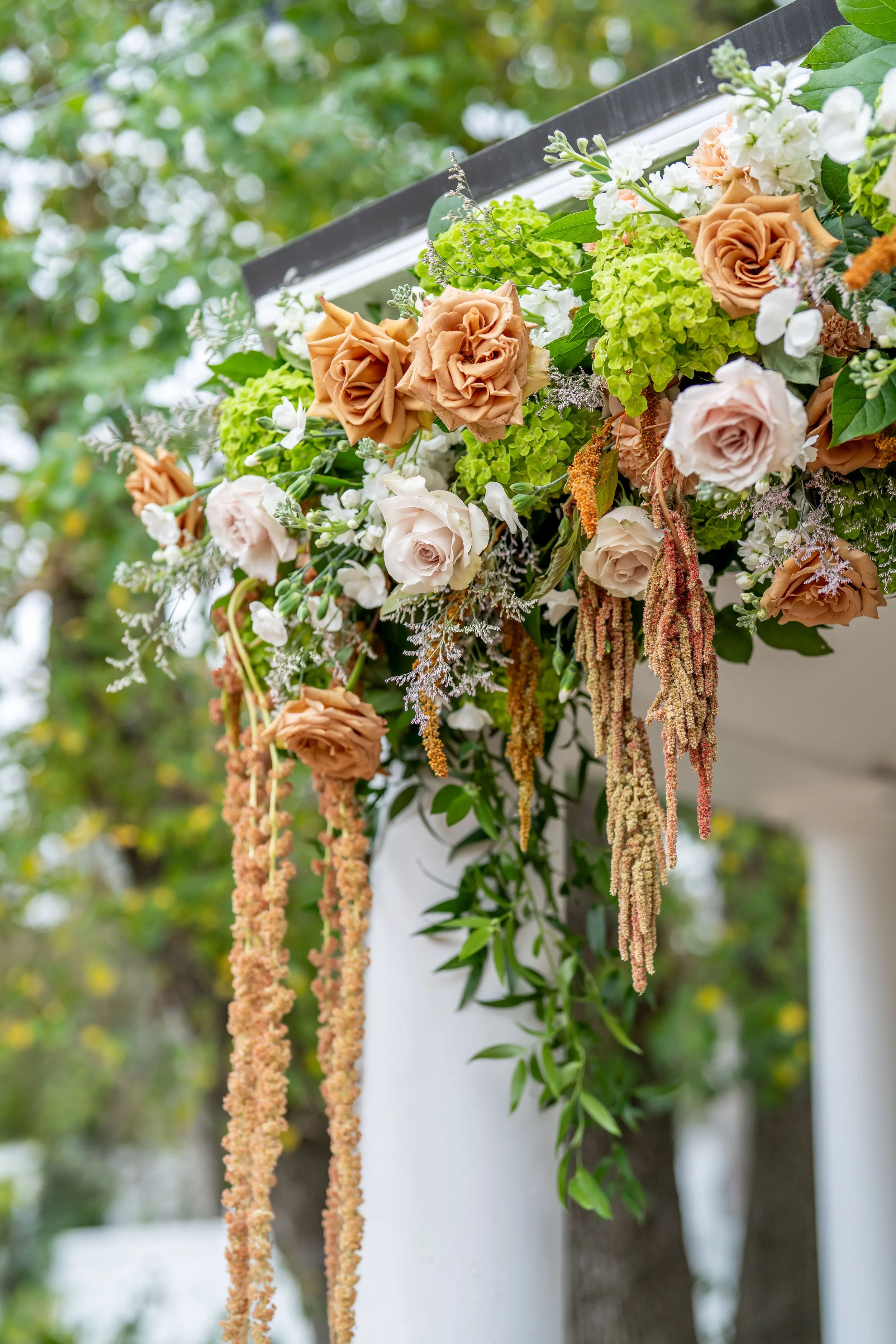 Wedding florals by Lush Flowers featuring romantic fall tones and lush arrangements