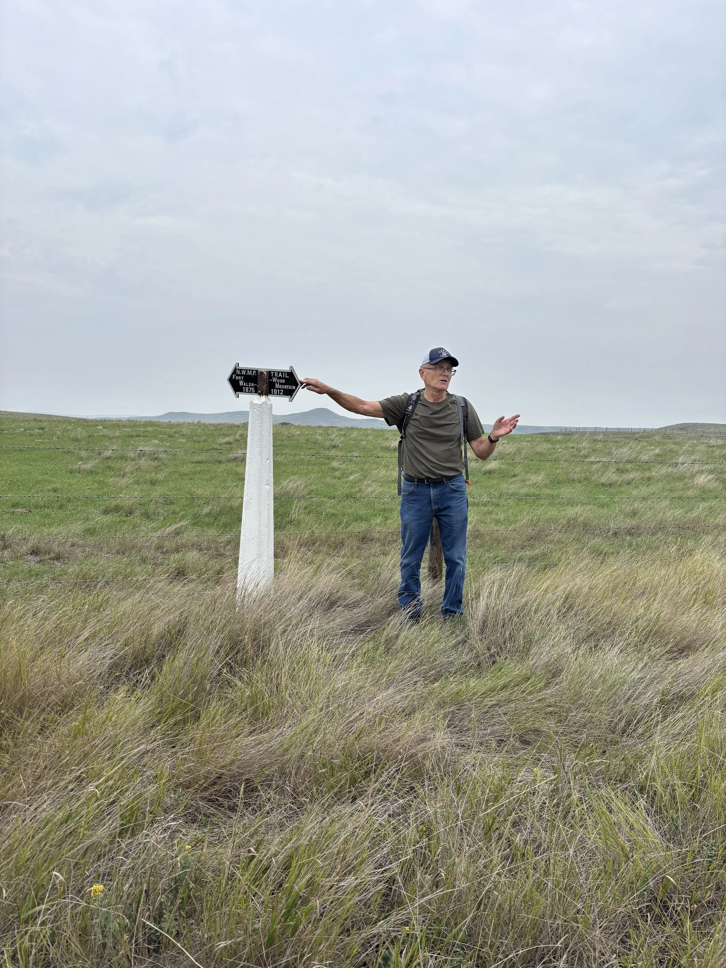 Hugh Henry and trail marker. 