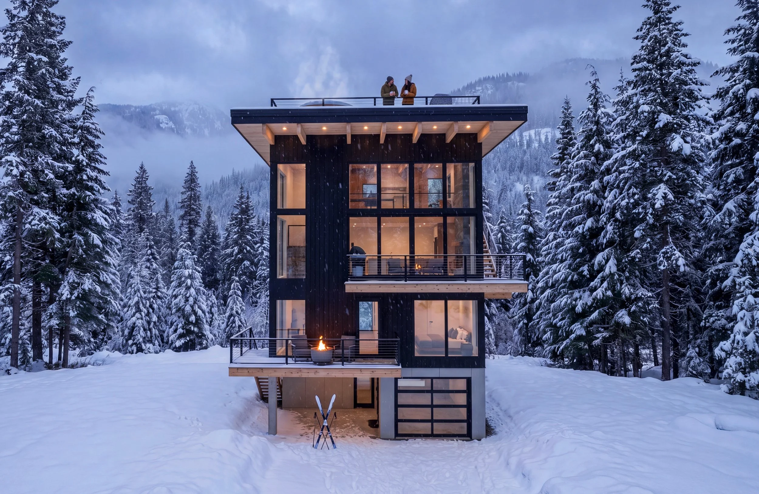 Modern multi-story house with large windows in a snow-covered forest, two people on the upper balcony, fireplace visible inside, twilight scene