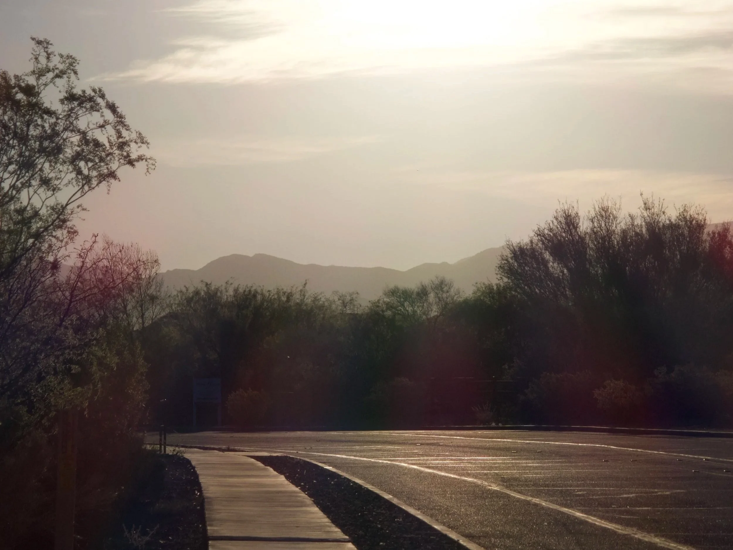 Early sunrise walk with mountains in the background.