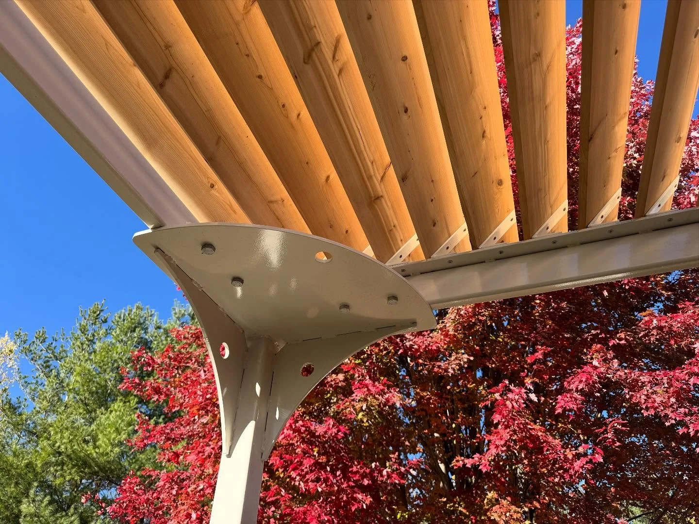 Pergolas are cool.  The goal was minimal architecture that was also beautiful. The “lily pads” allowed for both bracing and attachment, they also helped conceal the fact that the helical piers were just a bit out of square. This patio get