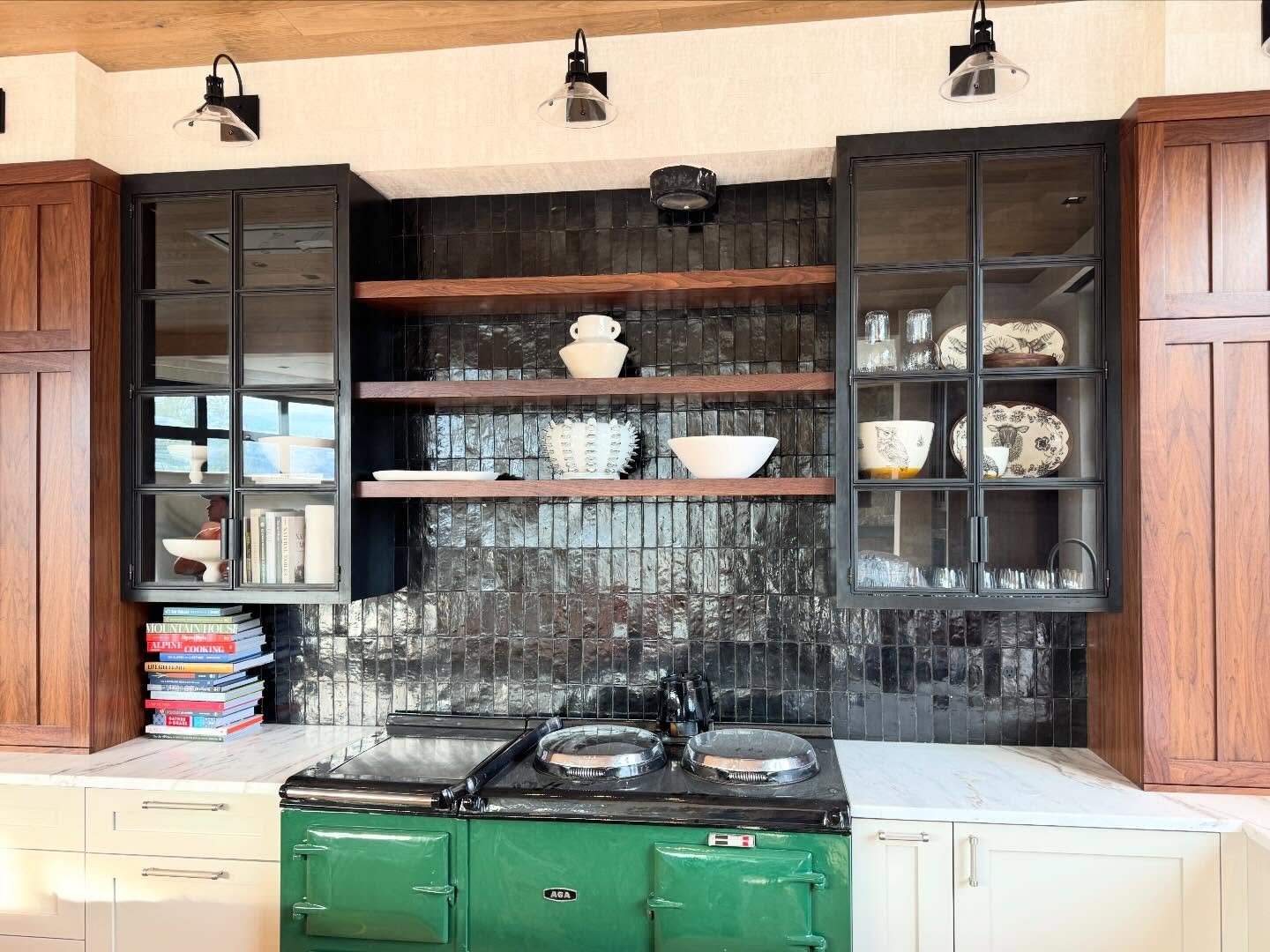 We loved building these cabinets. They are time consuming and challenging, but also elegant, and touch on our industrial roots. Sixteen truly divided lights deliver fine reveals and shadow lines. They operate smoothly and make for a beautiful focal p