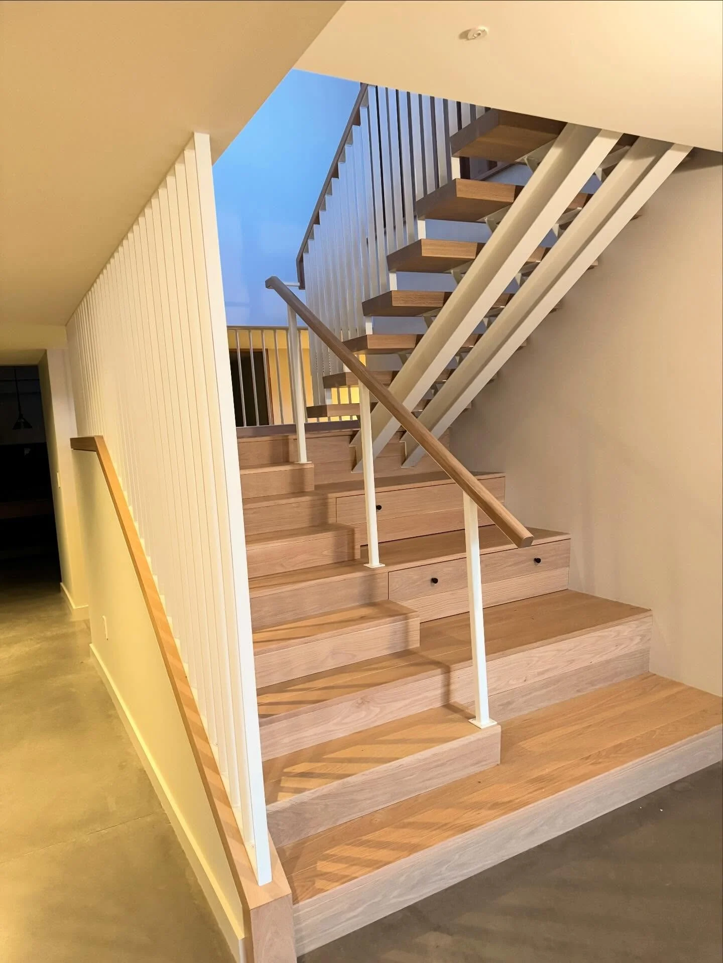 We get to build a lot of modern-looking stairs and railings.  This project with @newschoolbuilders and @truexcullins had some distinct visual interest, and striking contrasts.  The white steel with repeating patterns adds visual curiosity and light r