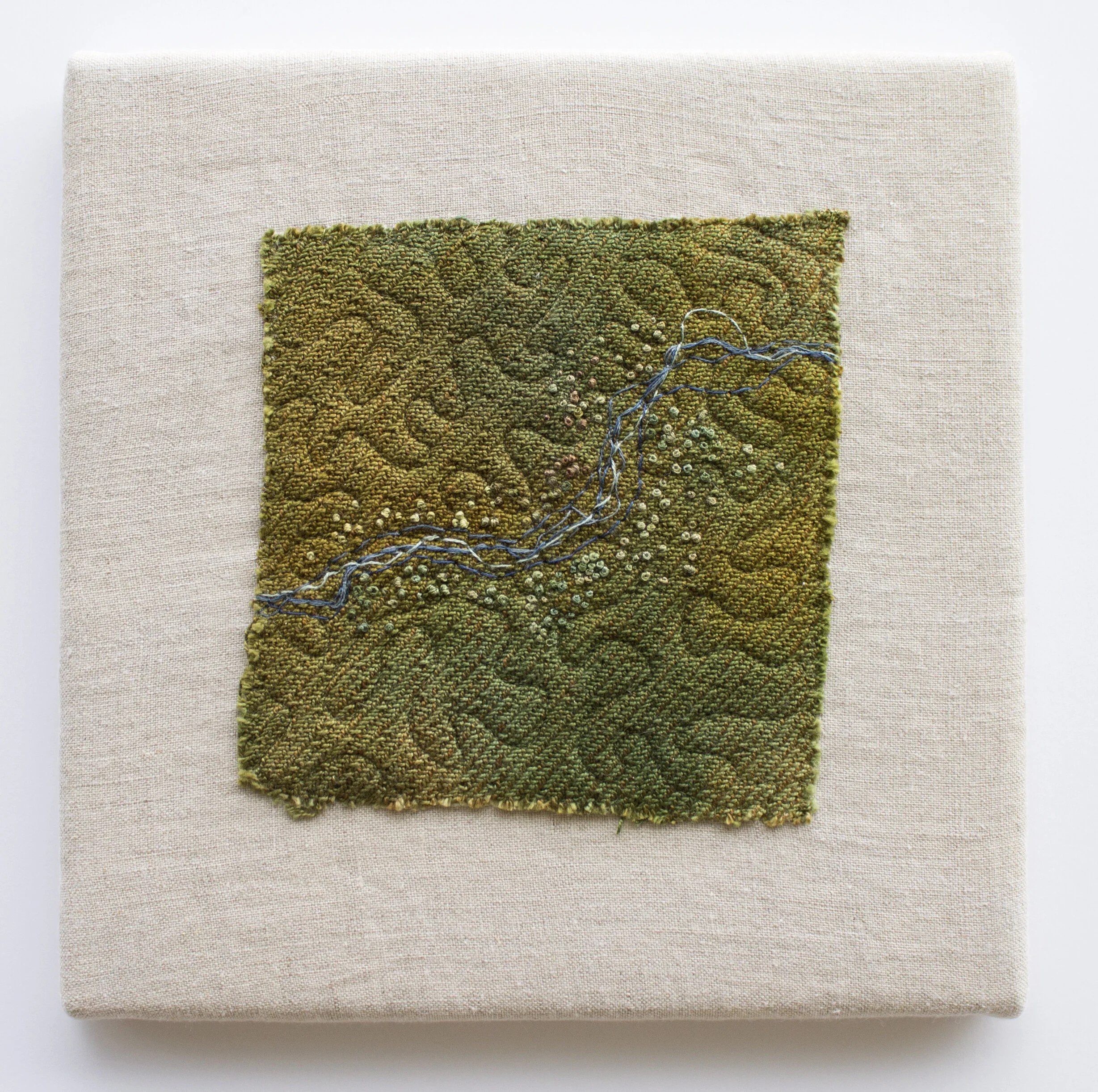 Mapping Memory III    10" h x 10" w x 1" d.   Cotton and linen.  Hand dyed and woven fabric, hand embroidery, and machine quilted. Mounted.  2019  This work was featured in the following exhibition:  Solo Show: Inheritance: The Endurance of Land S