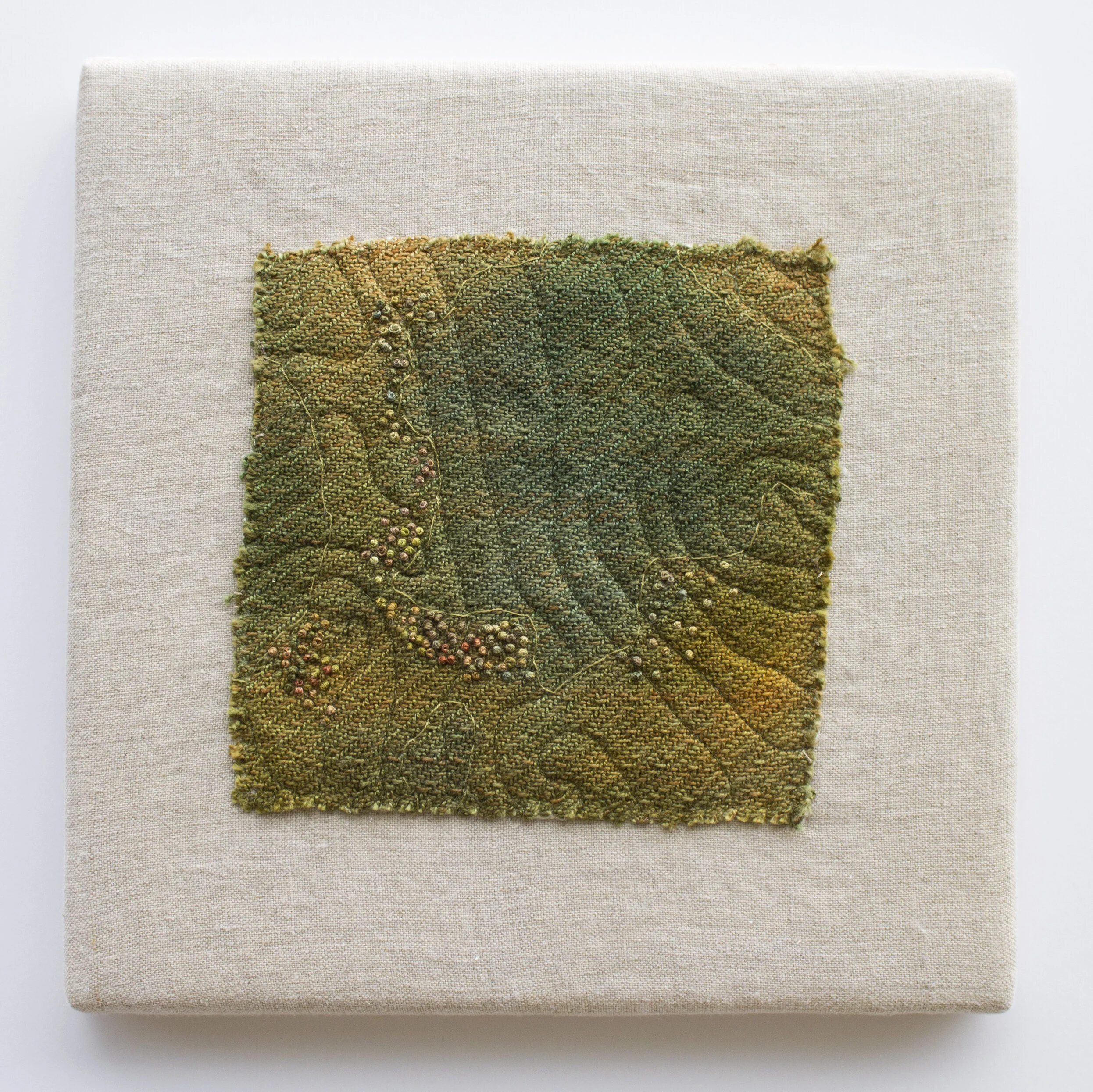 Mapping Memory IV    10" h x 10" w x 1" d.   Cotton and linen.  Hand dyed and woven fabric, hand embroidery, and machine quilted. Mounted.  2019  This work was featured in the following exhibition:  Solo Show: Inheritance: The Endurance of Land Se