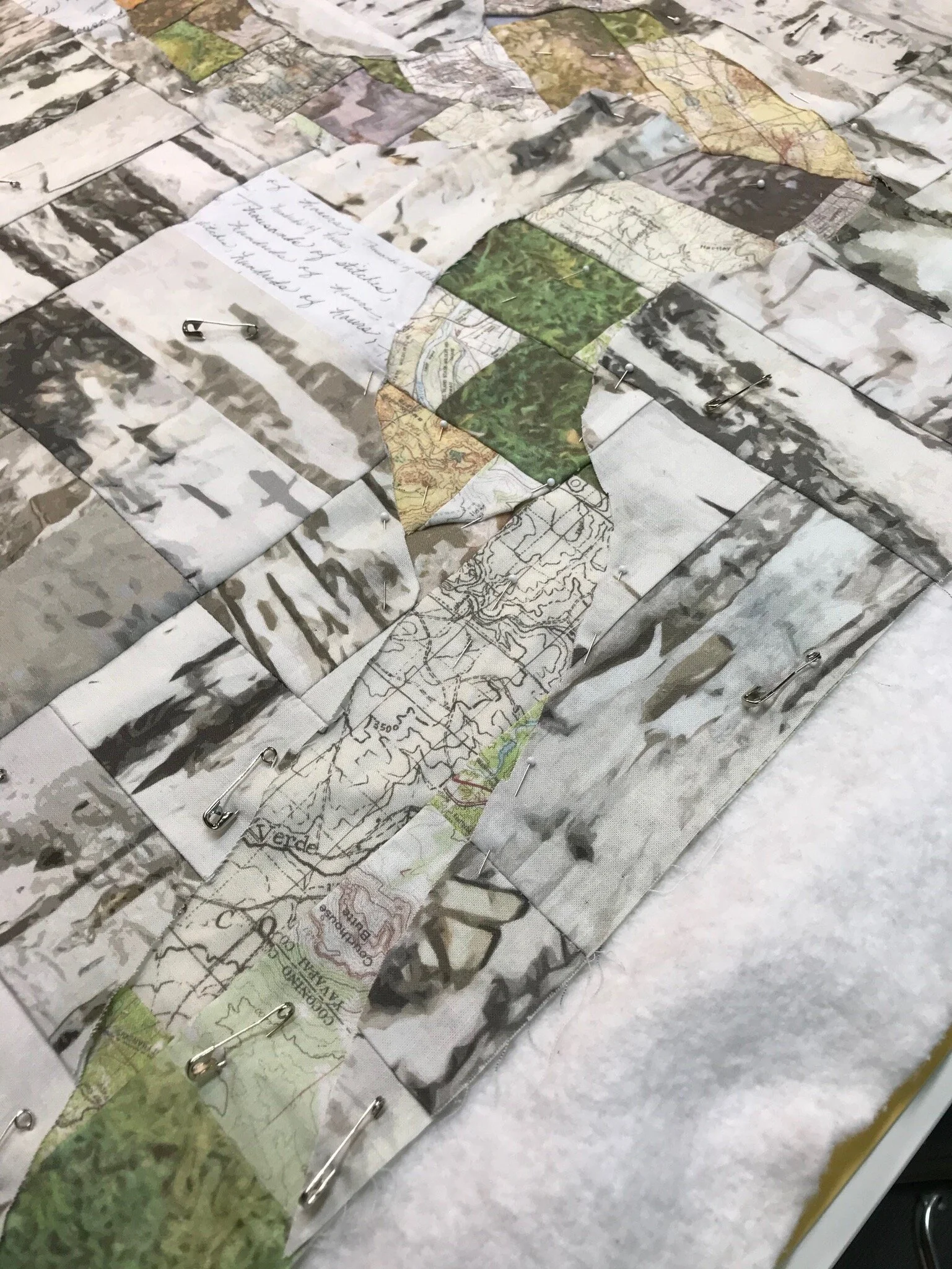 The map scraps of fabric inserted and pinned.