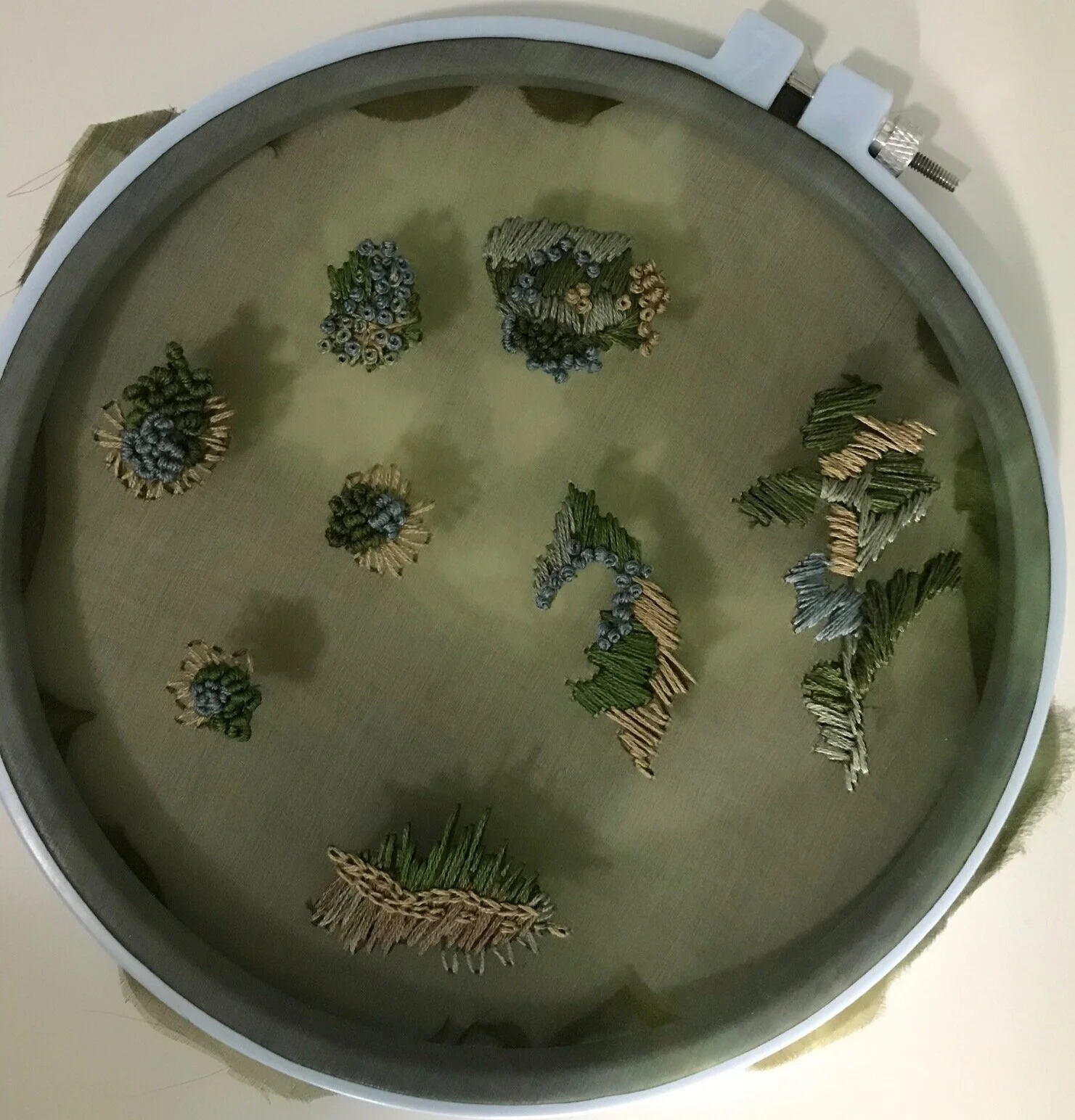 Embroidered pieces before cutting them apart