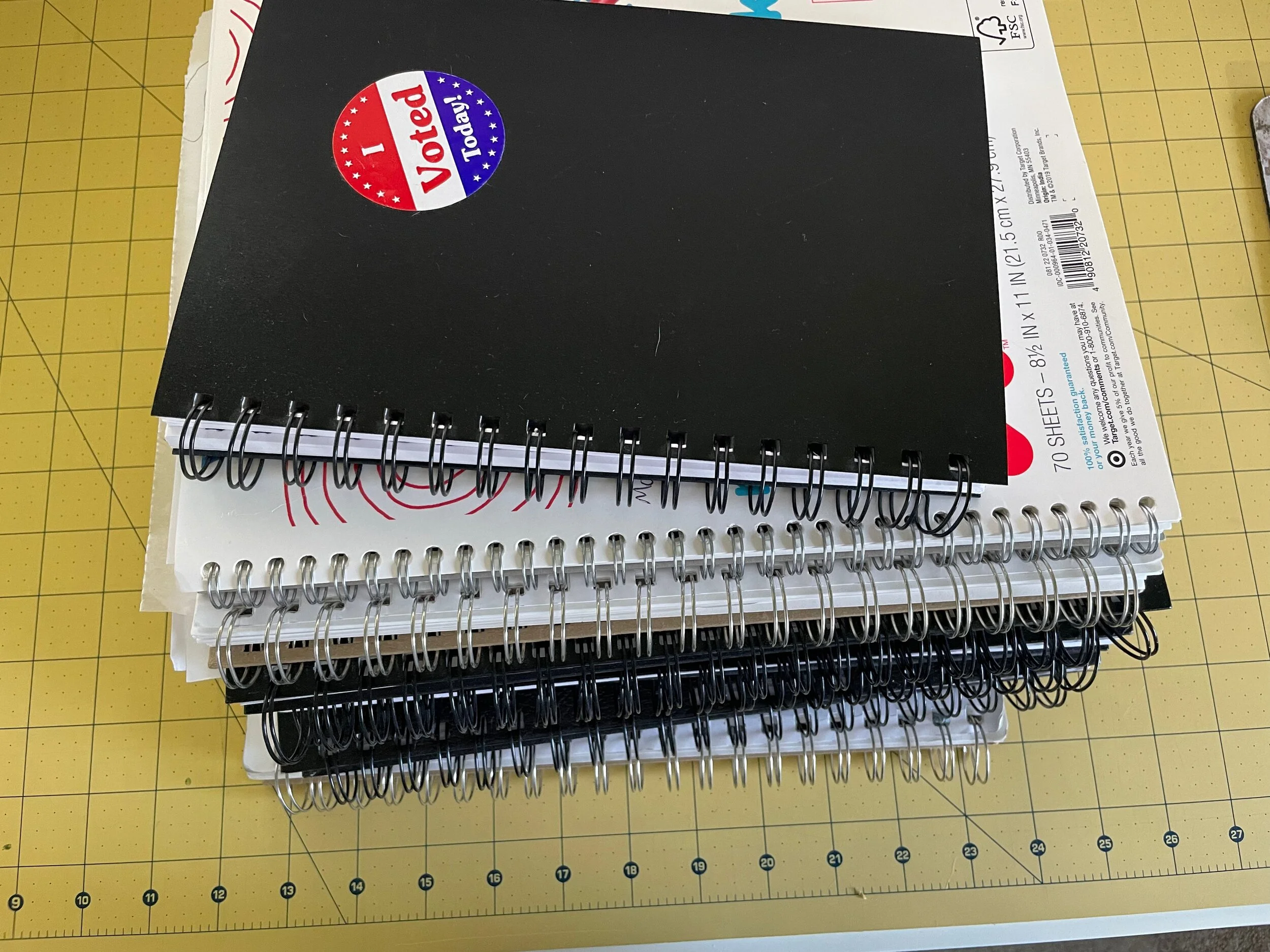 a stack of sketchbooks