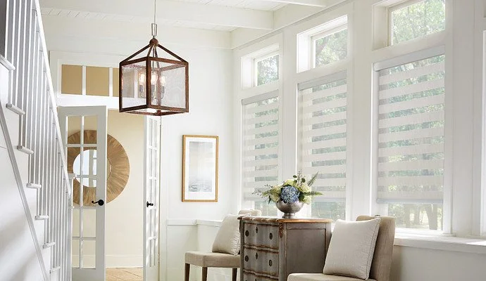 Layered shades materials with clean lines and a fabric-wrapped cassette for a modern take on light control