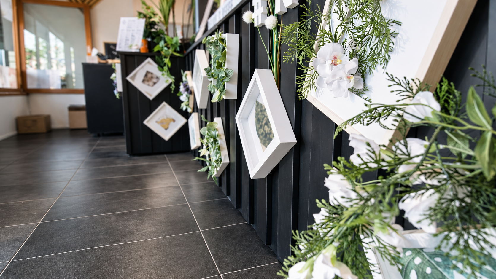 Black Slatted Cafe Counter and Greenery.png