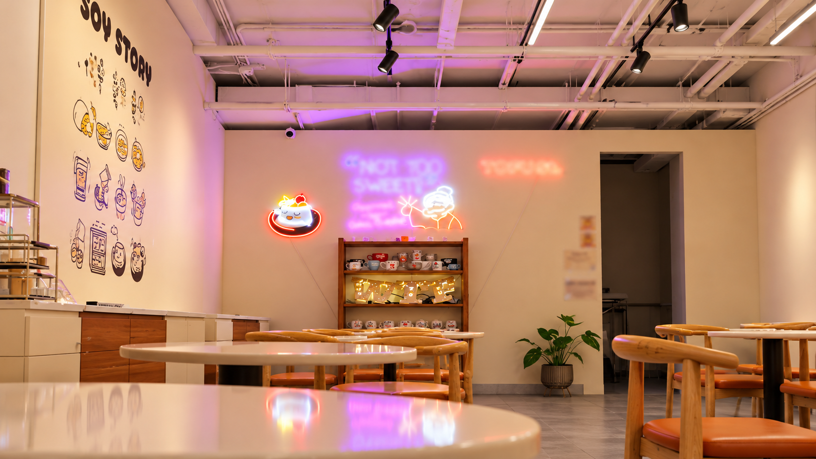 Neon-lit soy café interior.png