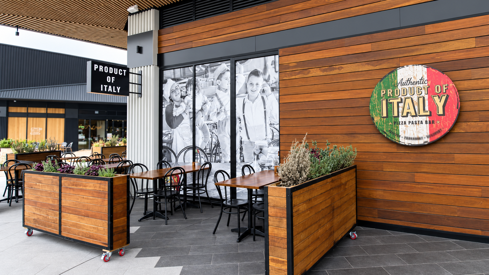 Italian restaurant terrace with monochrome window art.png