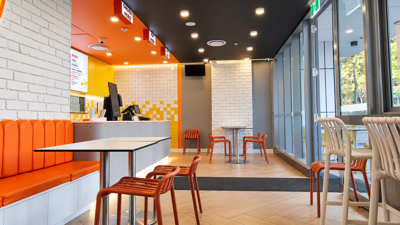 Modern Orange and Yellow Fast-Casual Café.png