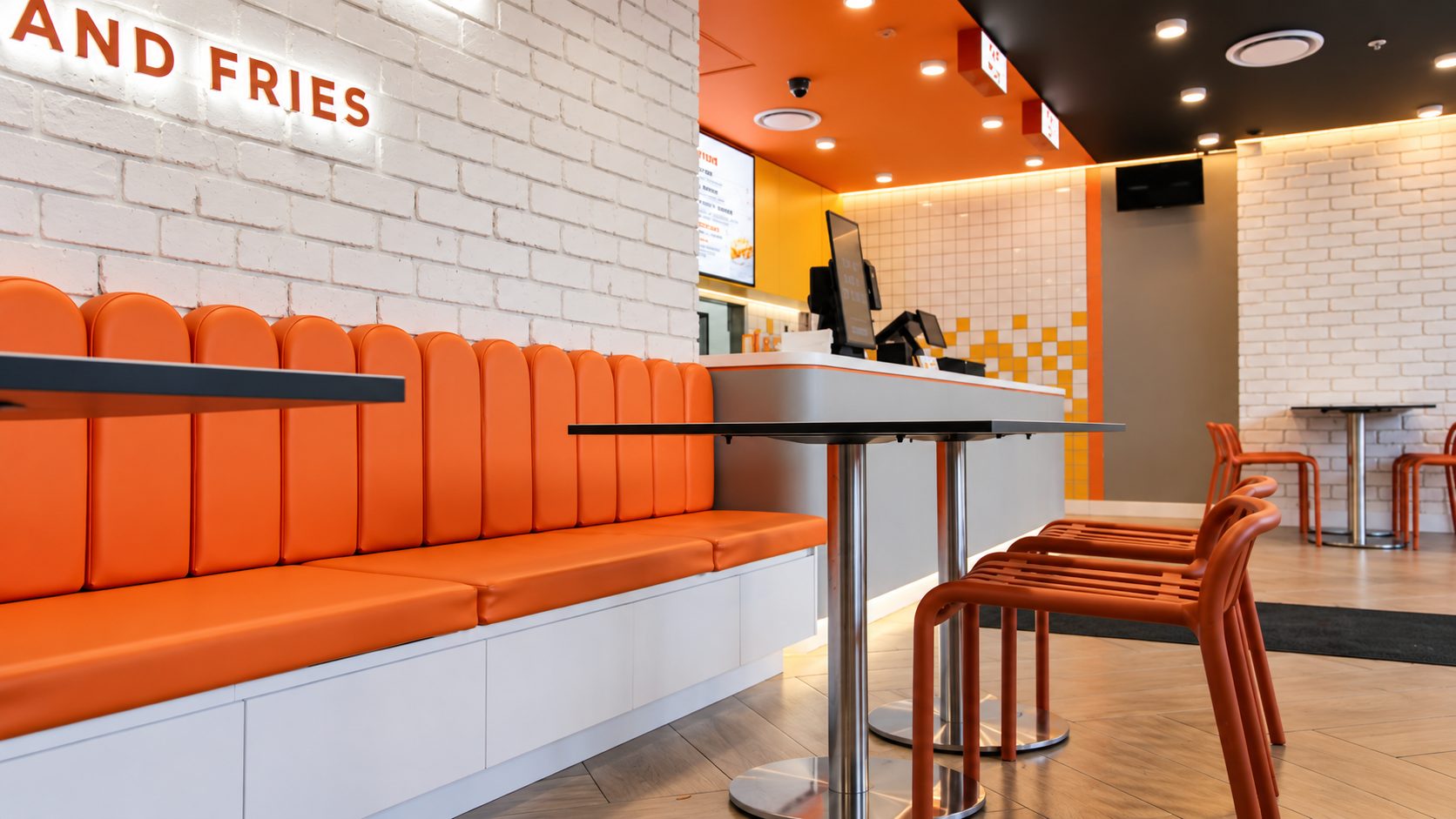Modern Orange-and-White Fast-Food Interior.png