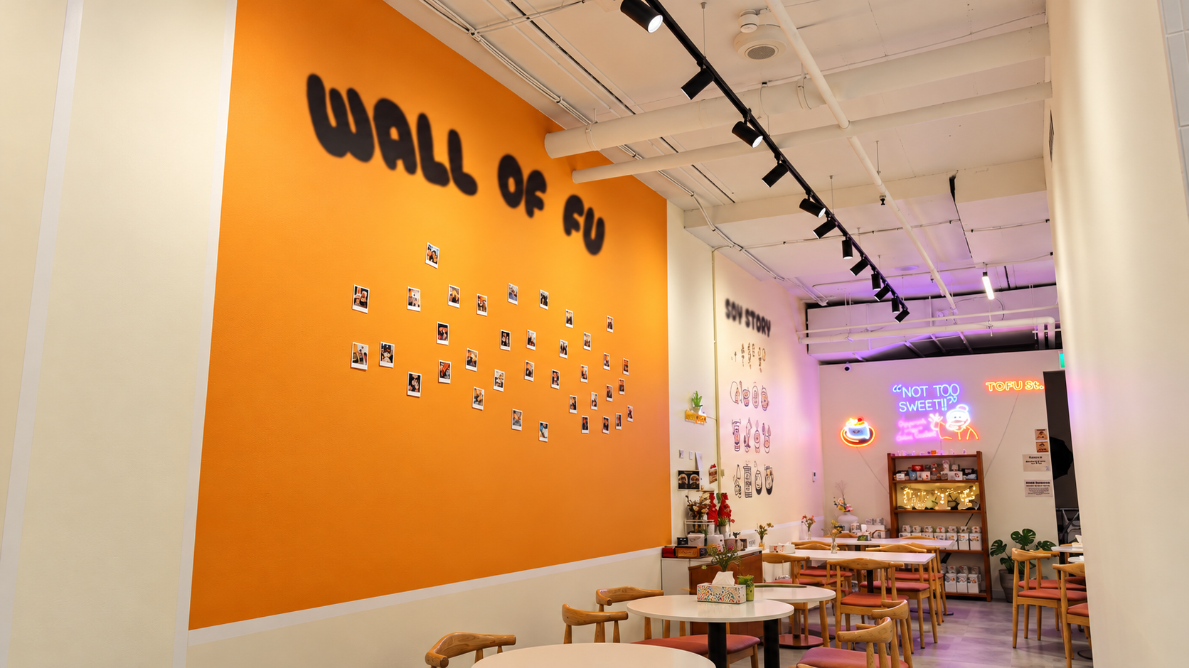 Polished cafe interior with orange feature wall.png