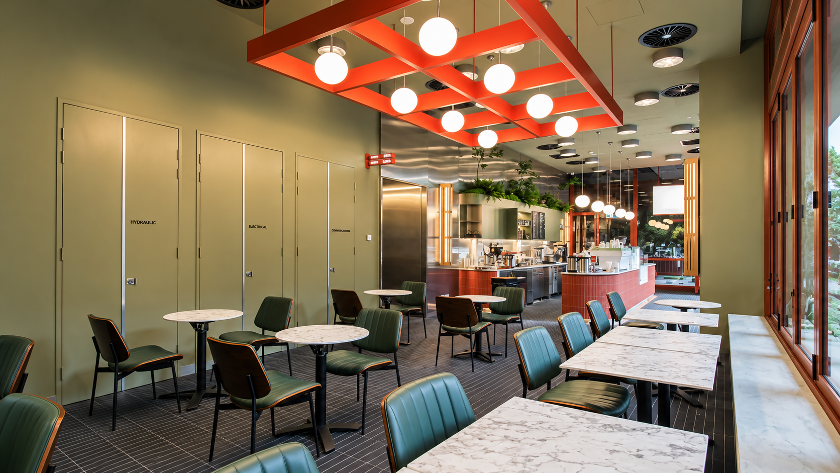 Modern Olive Café Interior with Globe Lights.png