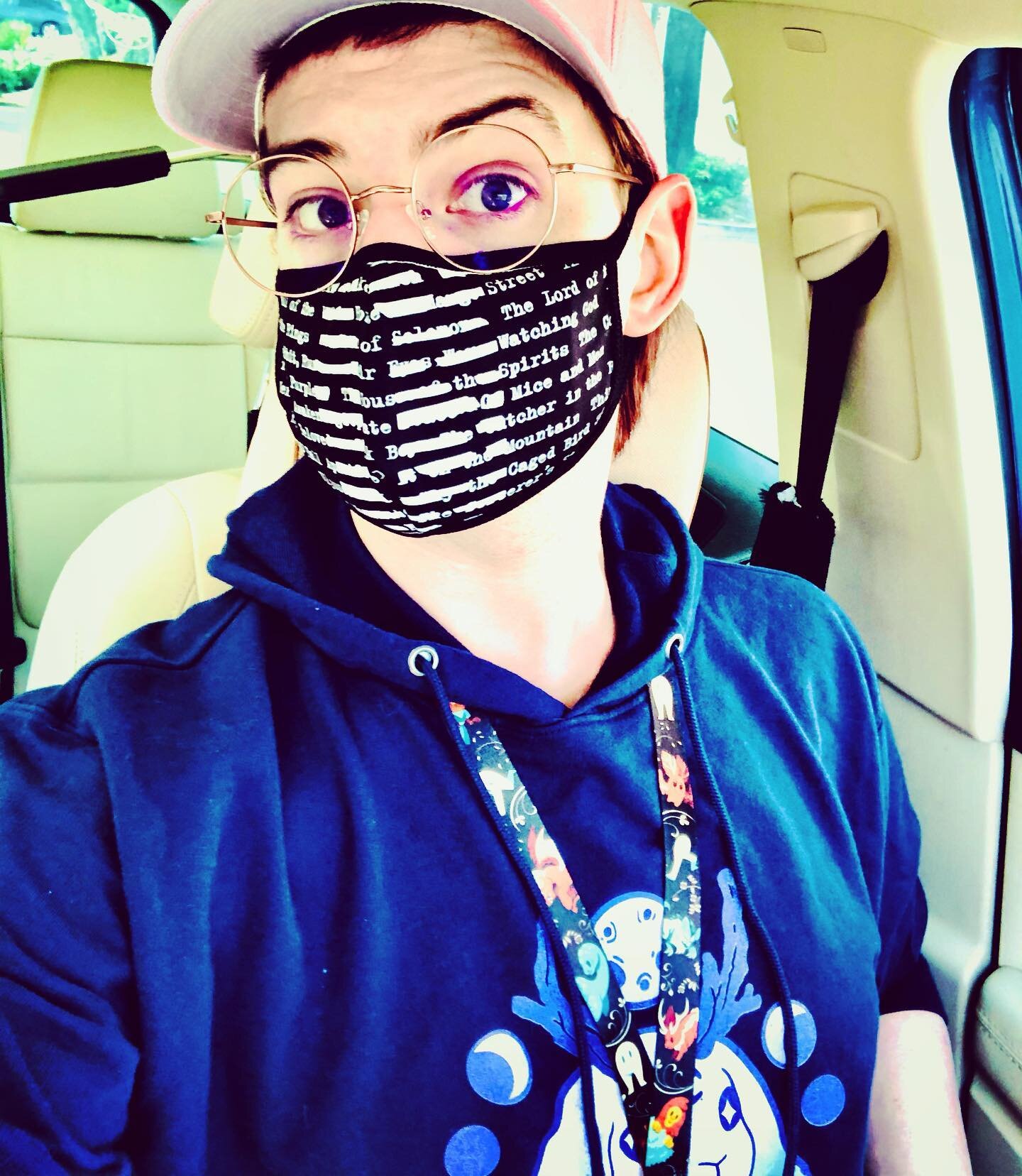 Was running late for my flu shot so I threw on my jackalope hoodie not thinking that my lanyard is cryptids and my mask is banned books——I look like I could go off about how Mothman killed JFK at literally any moment.
