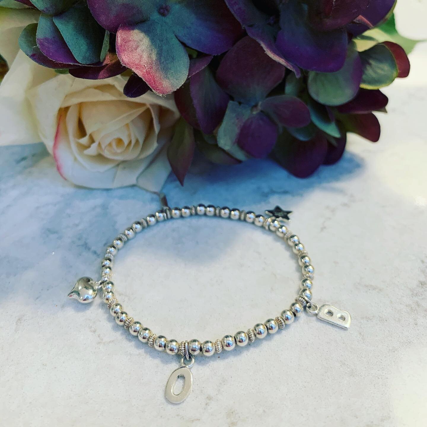 The initial bracelet, can be customised with up to 4 letters or a combination of letters and charms. Gorgeous gift idea for Mother&rsquo;s Day. X