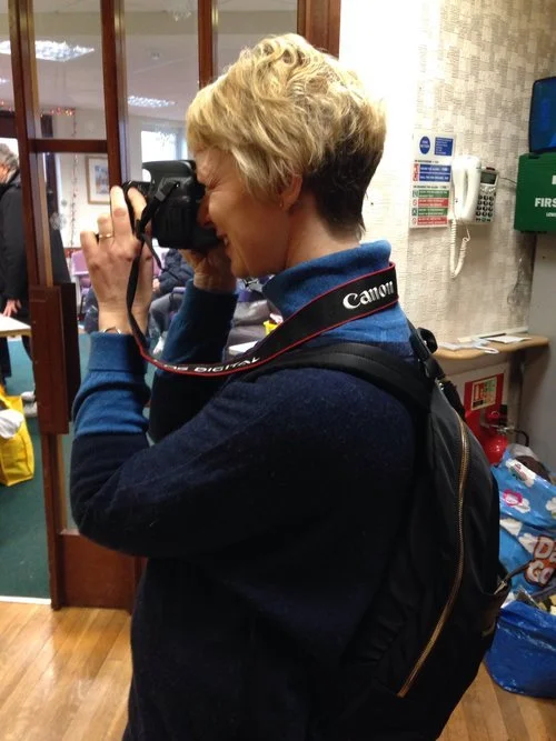 Rosie Brown, co-owner and host at work as artist in residence at refugee charity carriers of hope