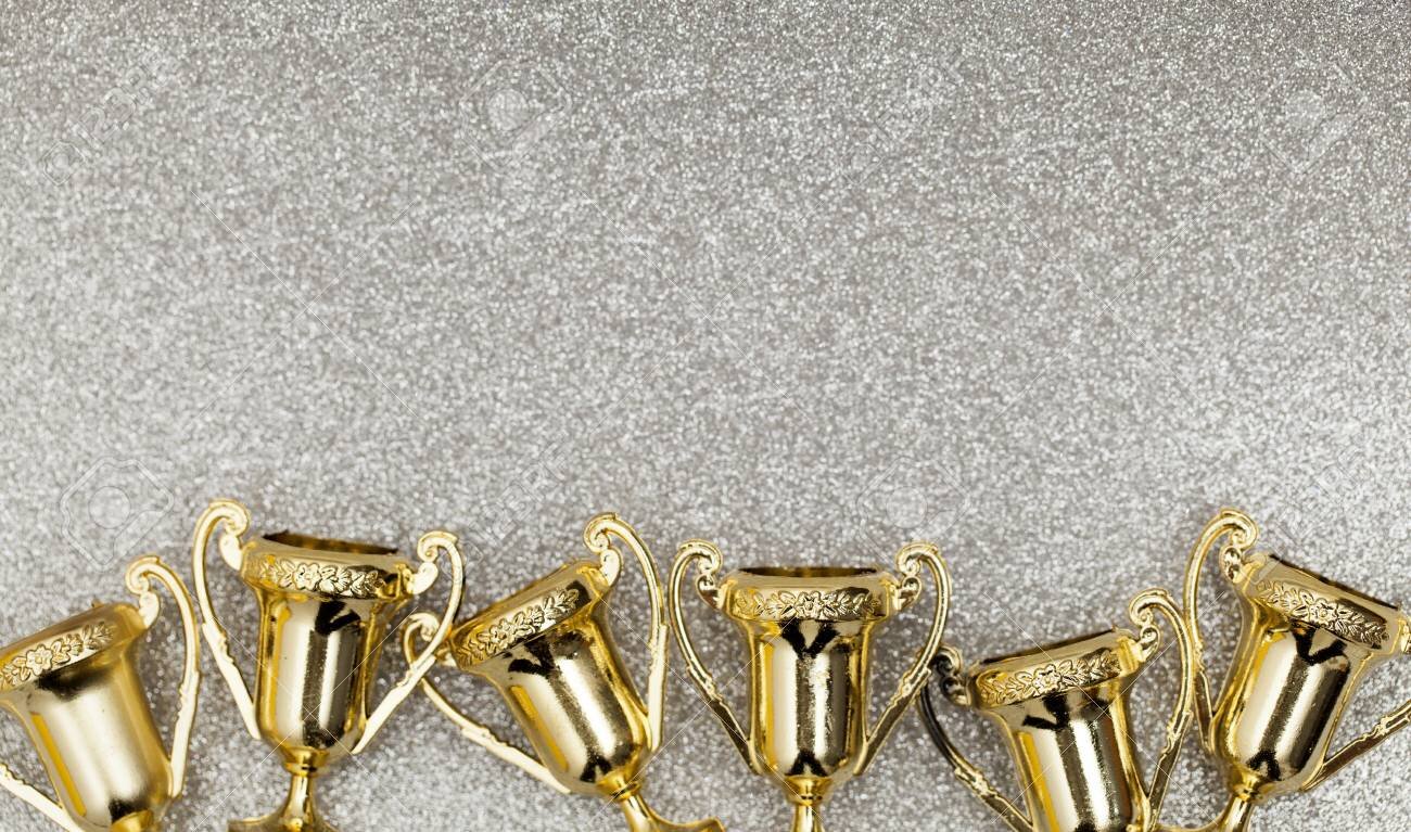 91708200-gold-winners-achievement-trophy-background.jpg