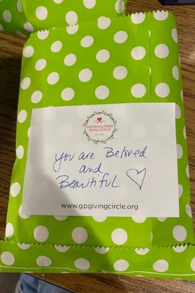 Gift bag with tag saying "You are beloved and beautiful"