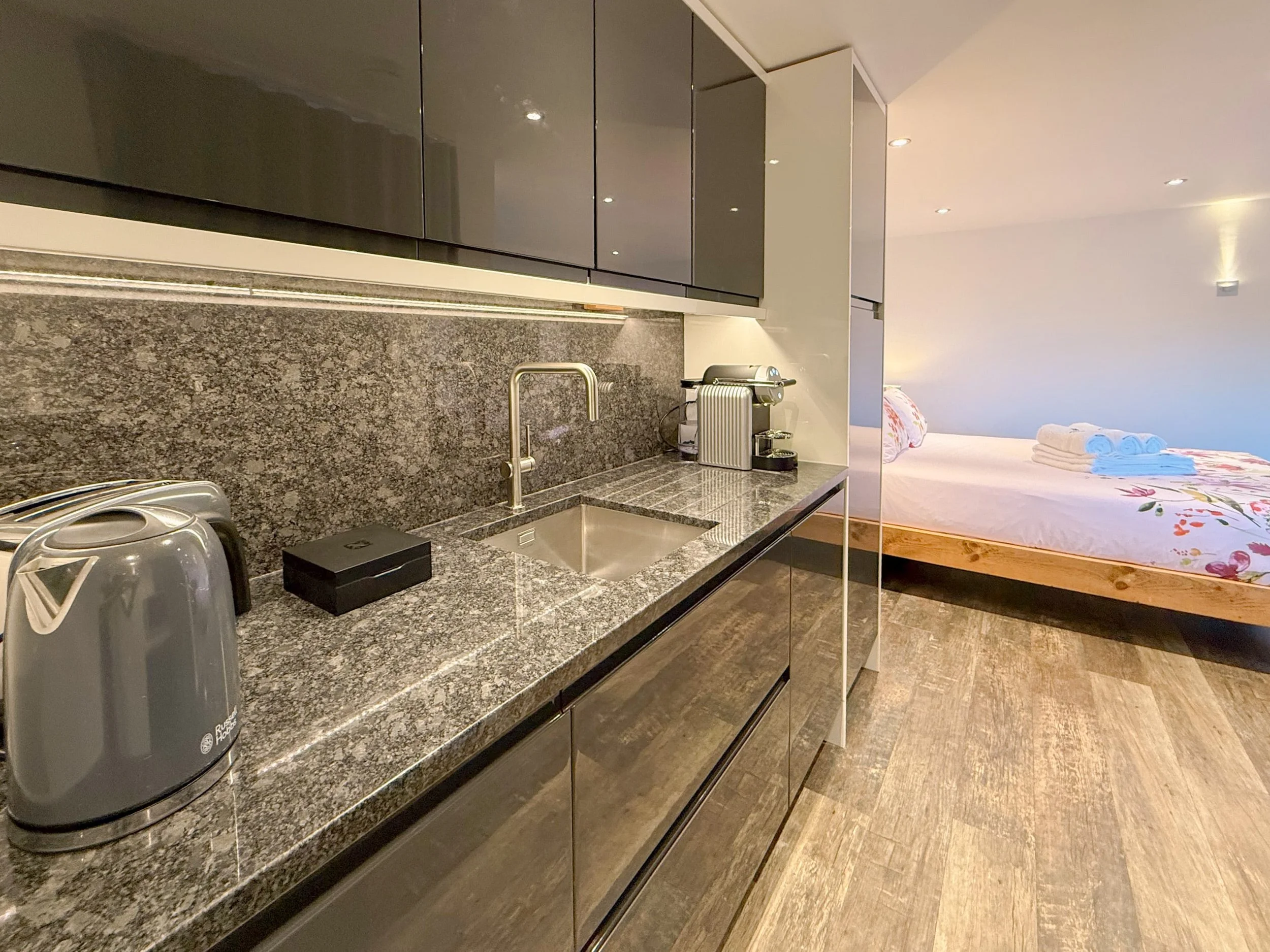 Compact kitchenette with granite worktop and Nespresso coffee machine