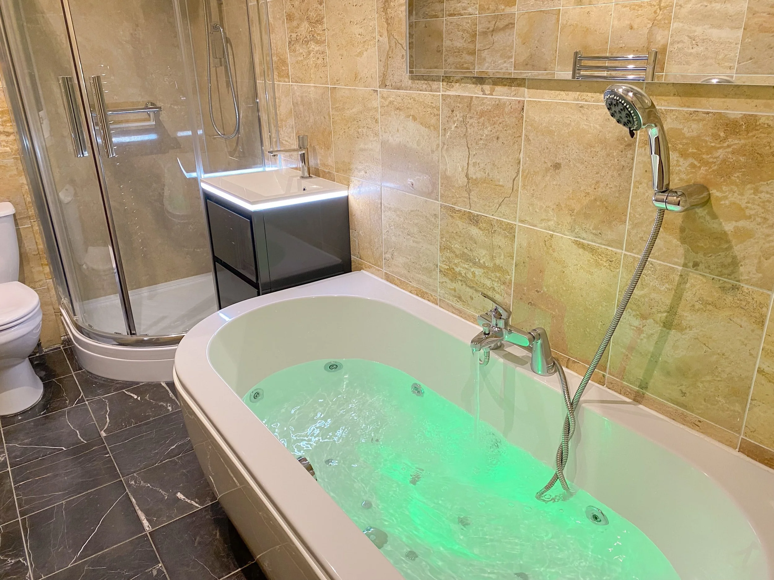 Spa bath with colour changing lighting