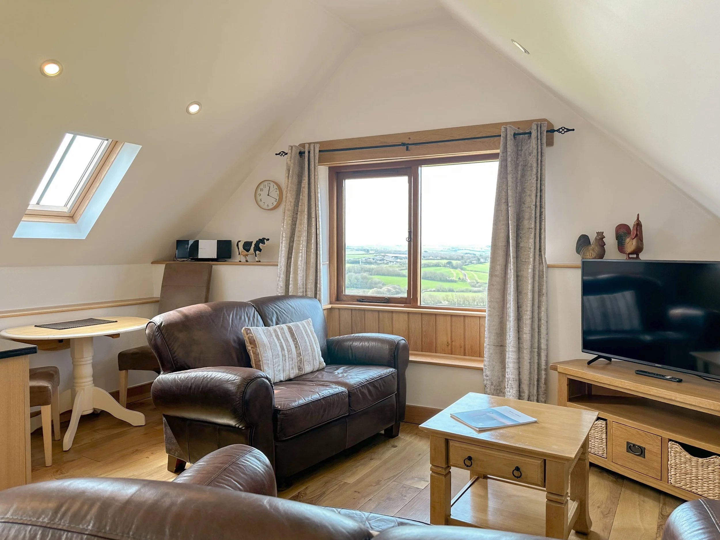 Living and dining area with countryside and sea view