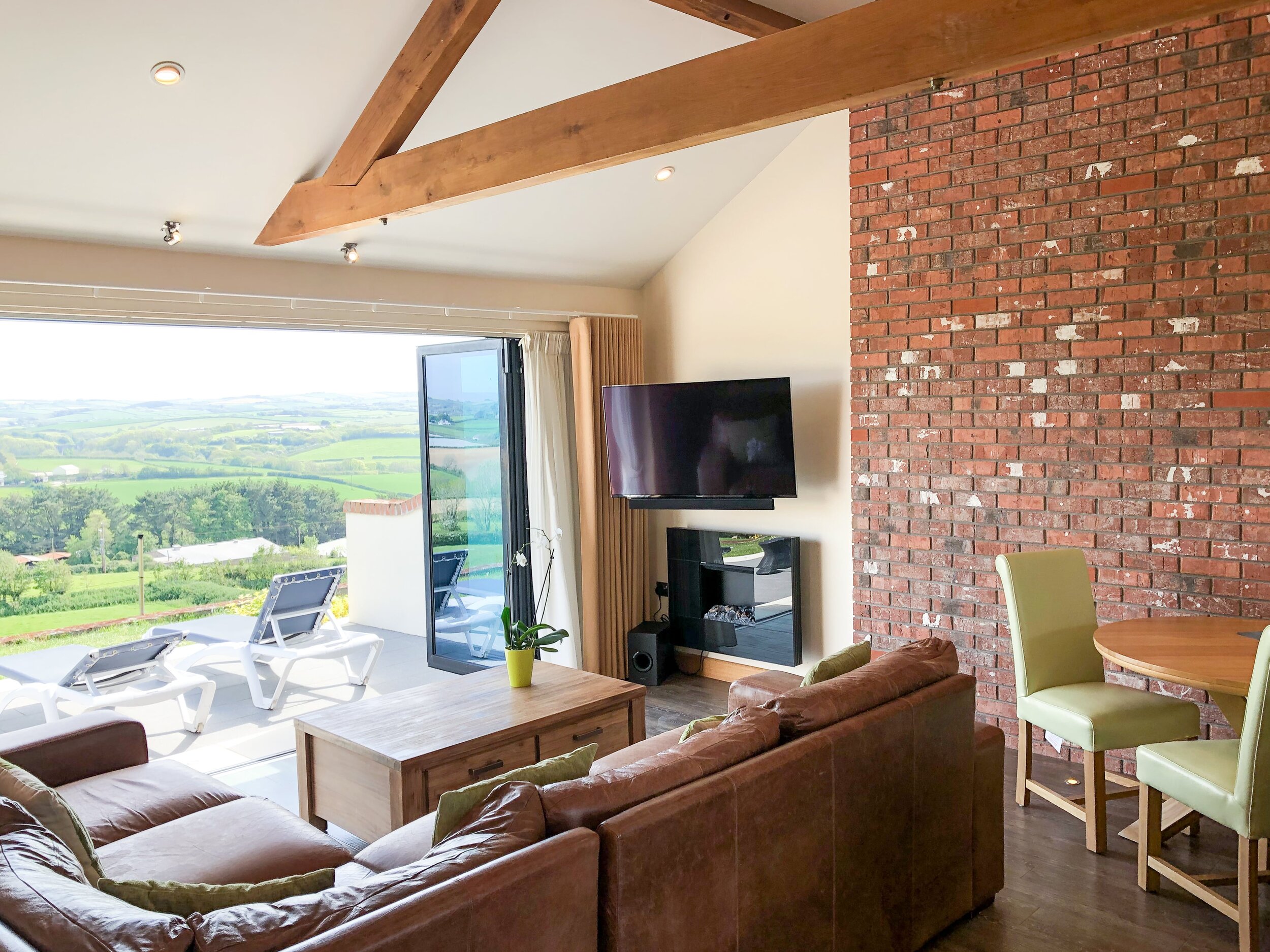 Corner sofa in the living area of Moonshine with countryside views