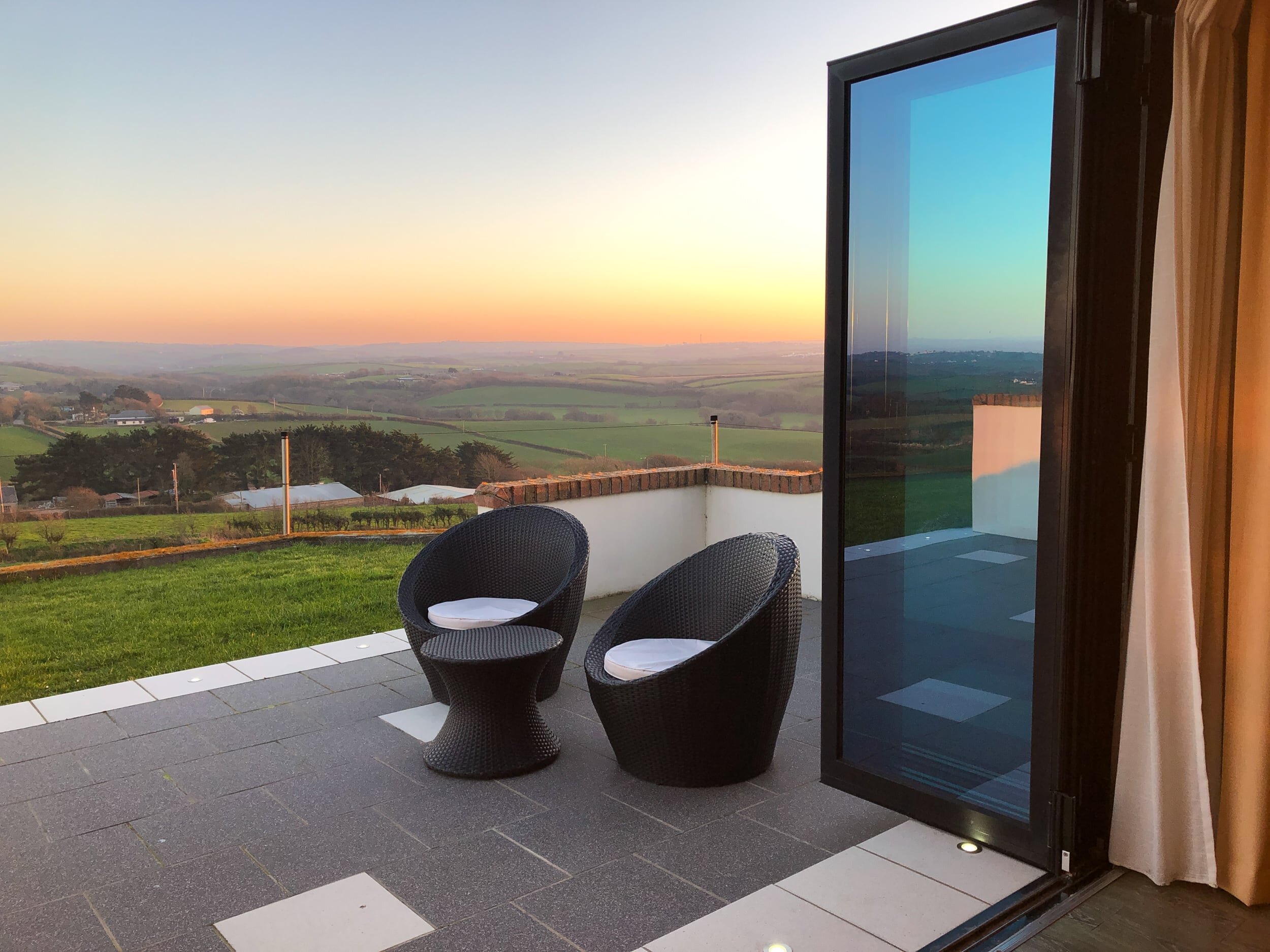 Private patio area with countryside valley views and sea view