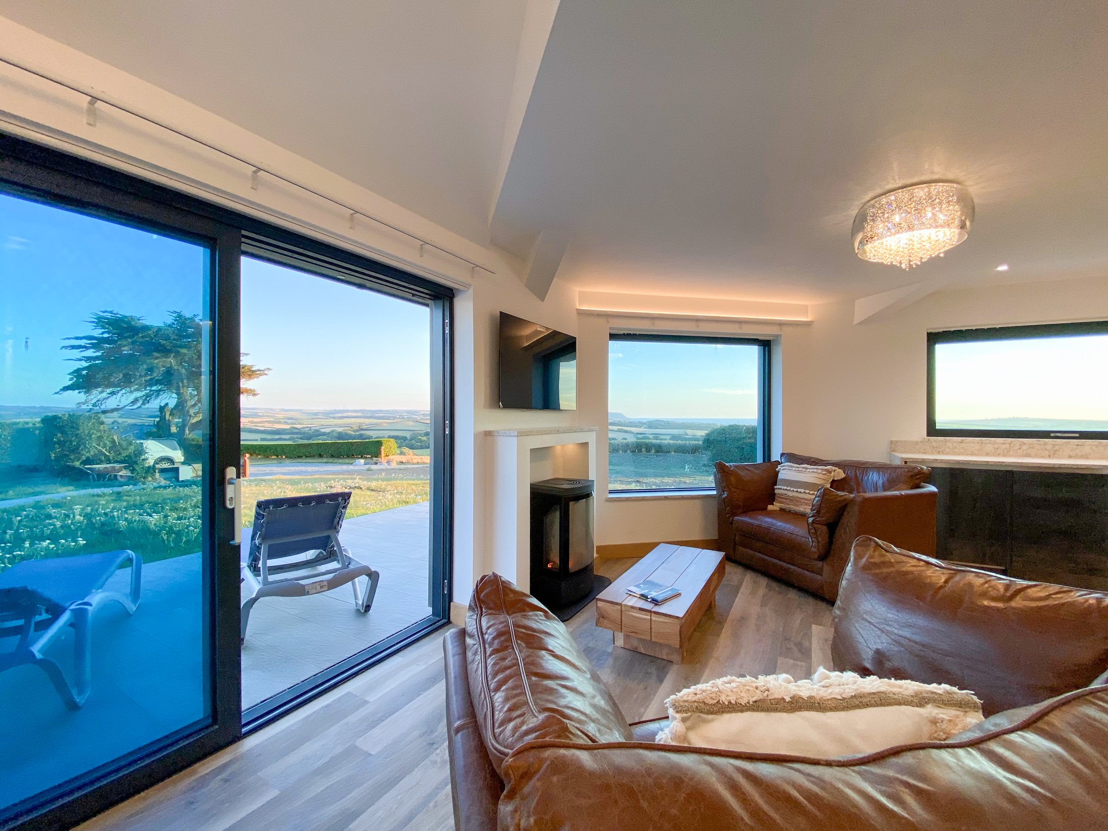 Living area with countryside and sea views