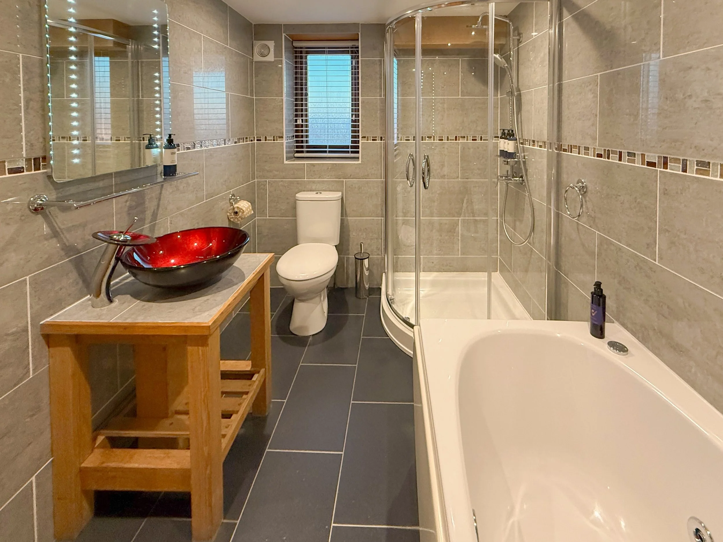 Bathroom with spa bath and walk-in rainfall shower