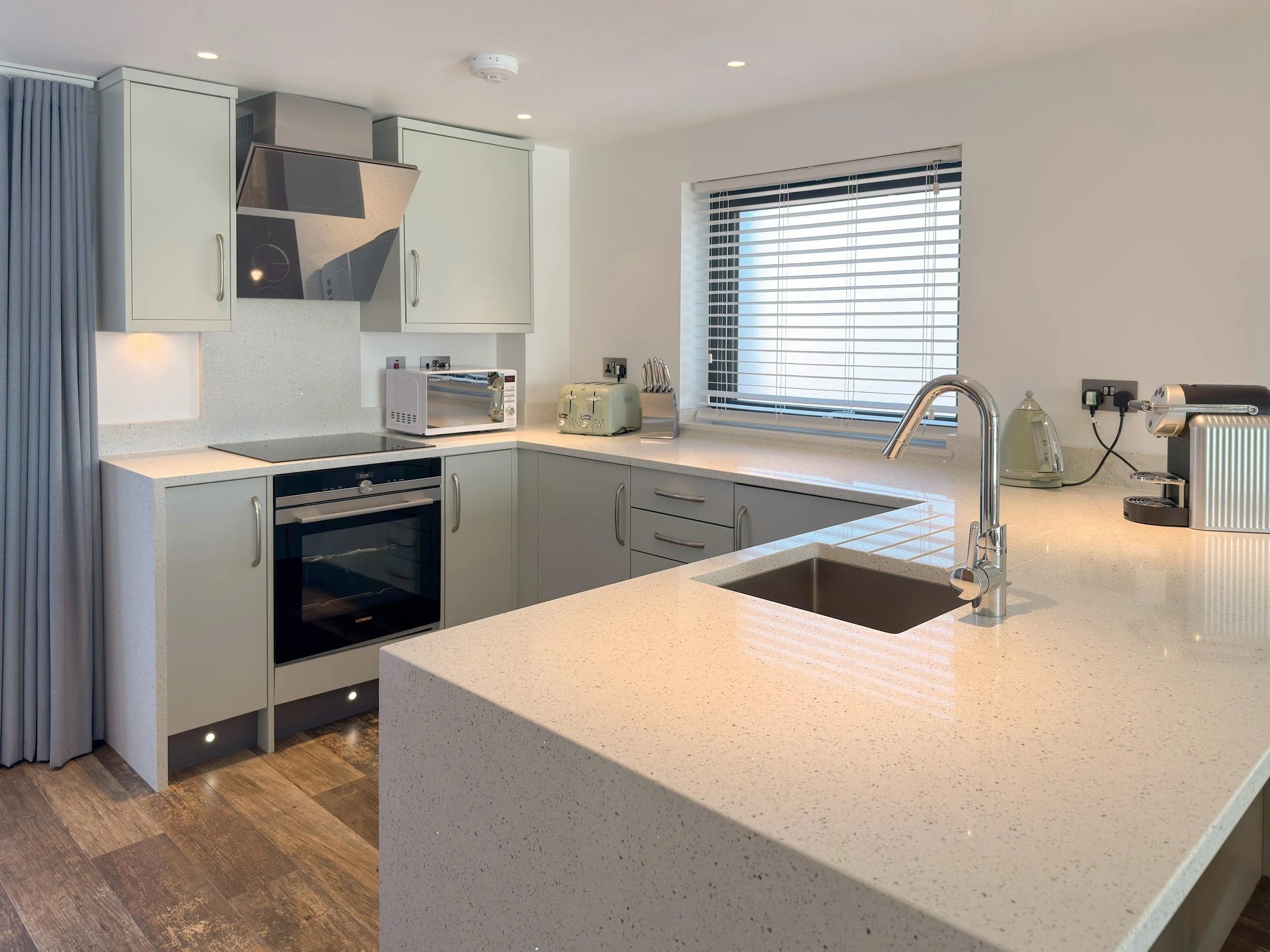 Open plan kitchen with Nespresso coffee machine