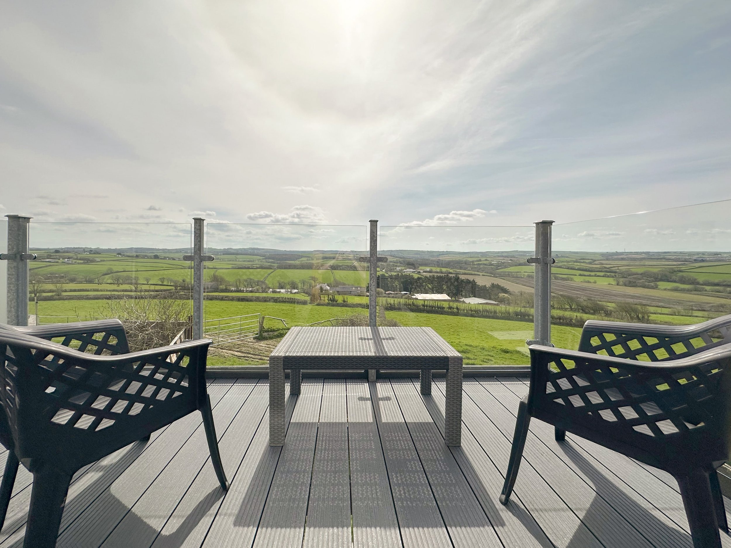 Balcony with countryside and sea views