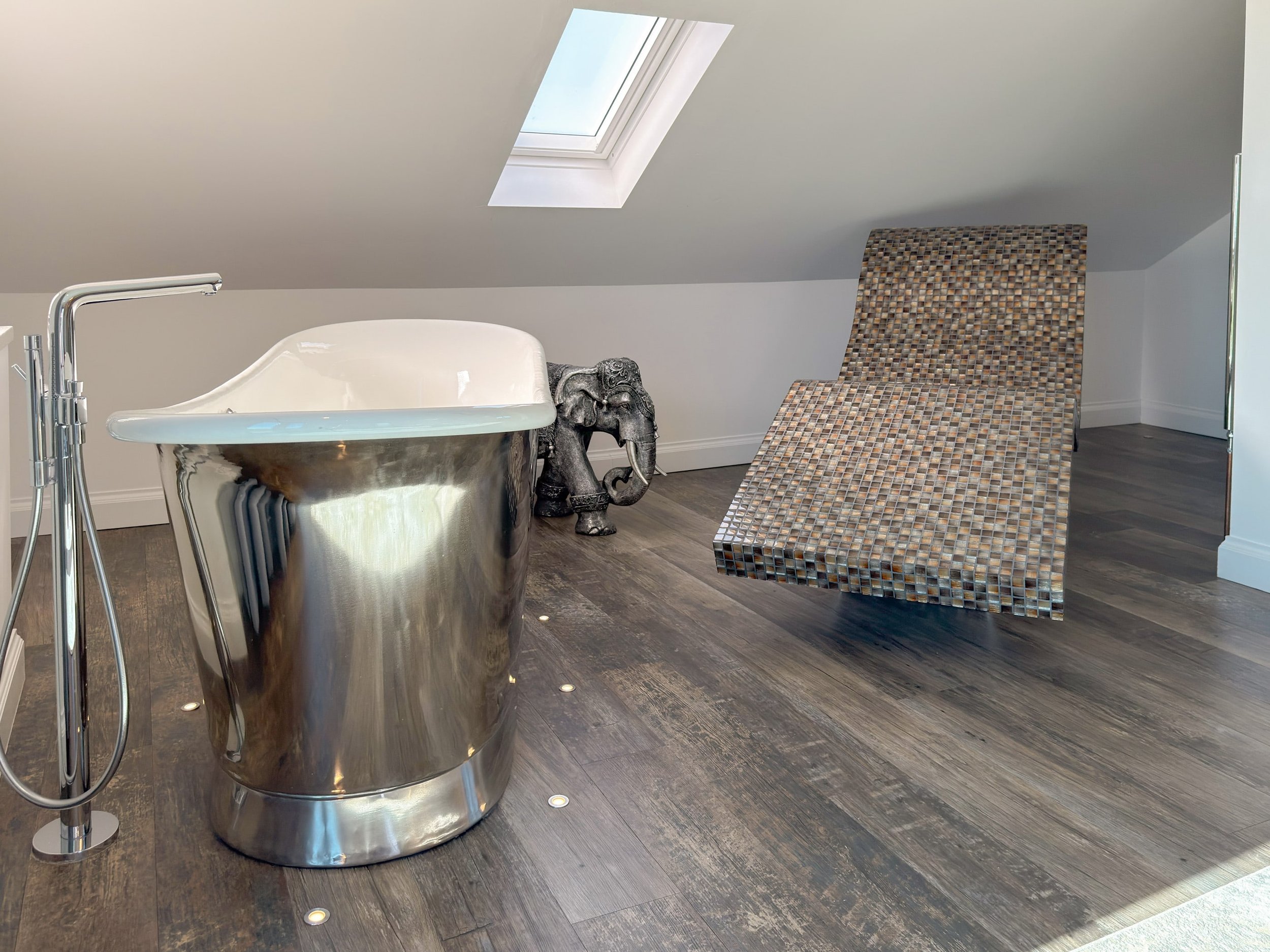 Freestanding air-spa bath and heated lounger chair for the ultimate in relaxation