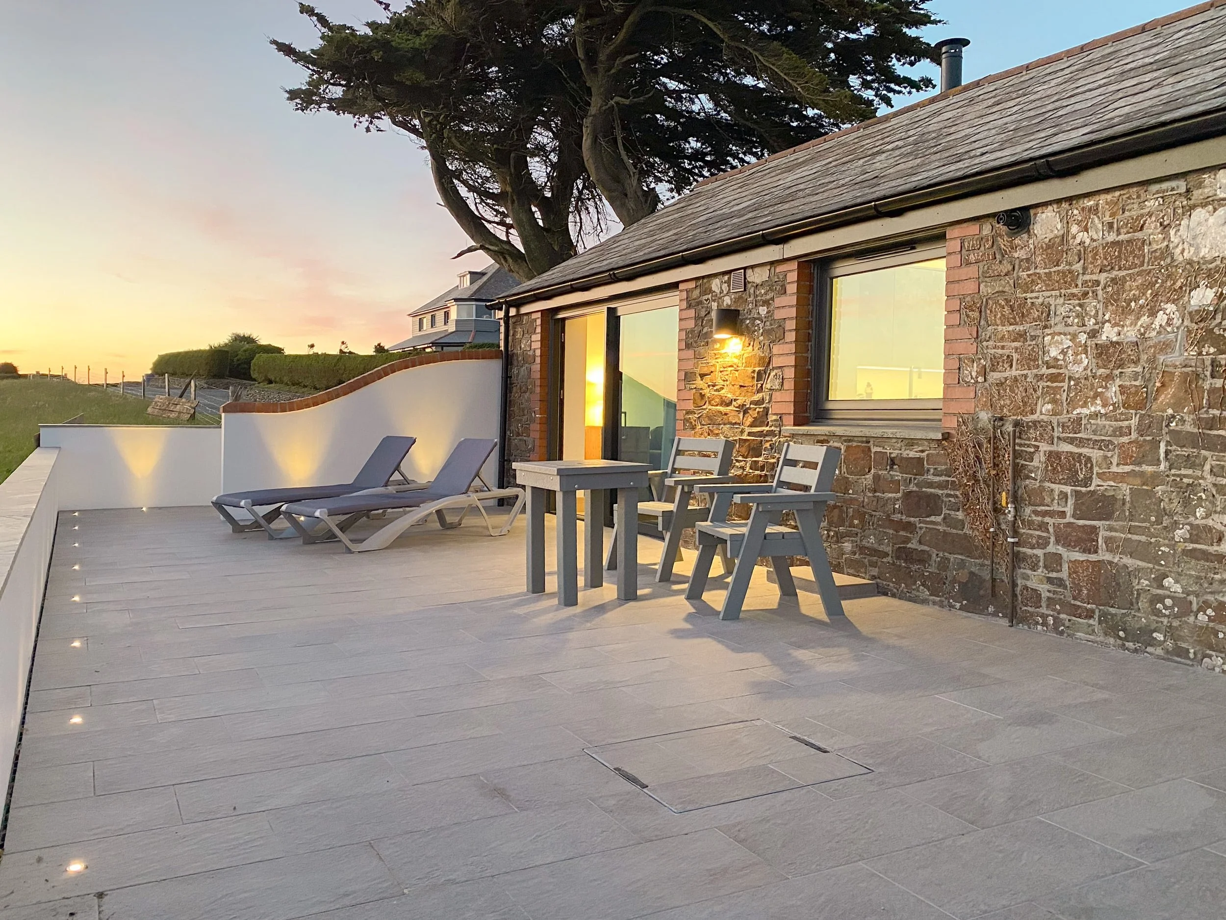 Private patio with sunset views over Widemouth Bay