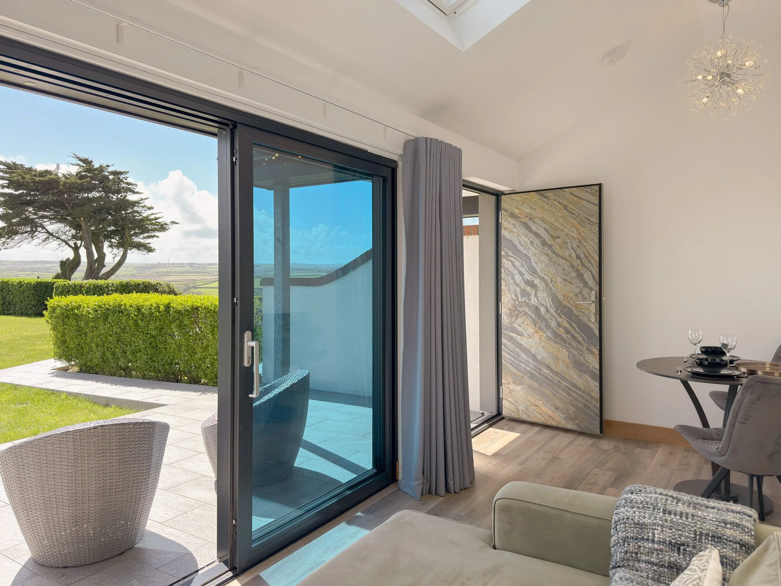 Living area sliding doors onto patio with South facing views