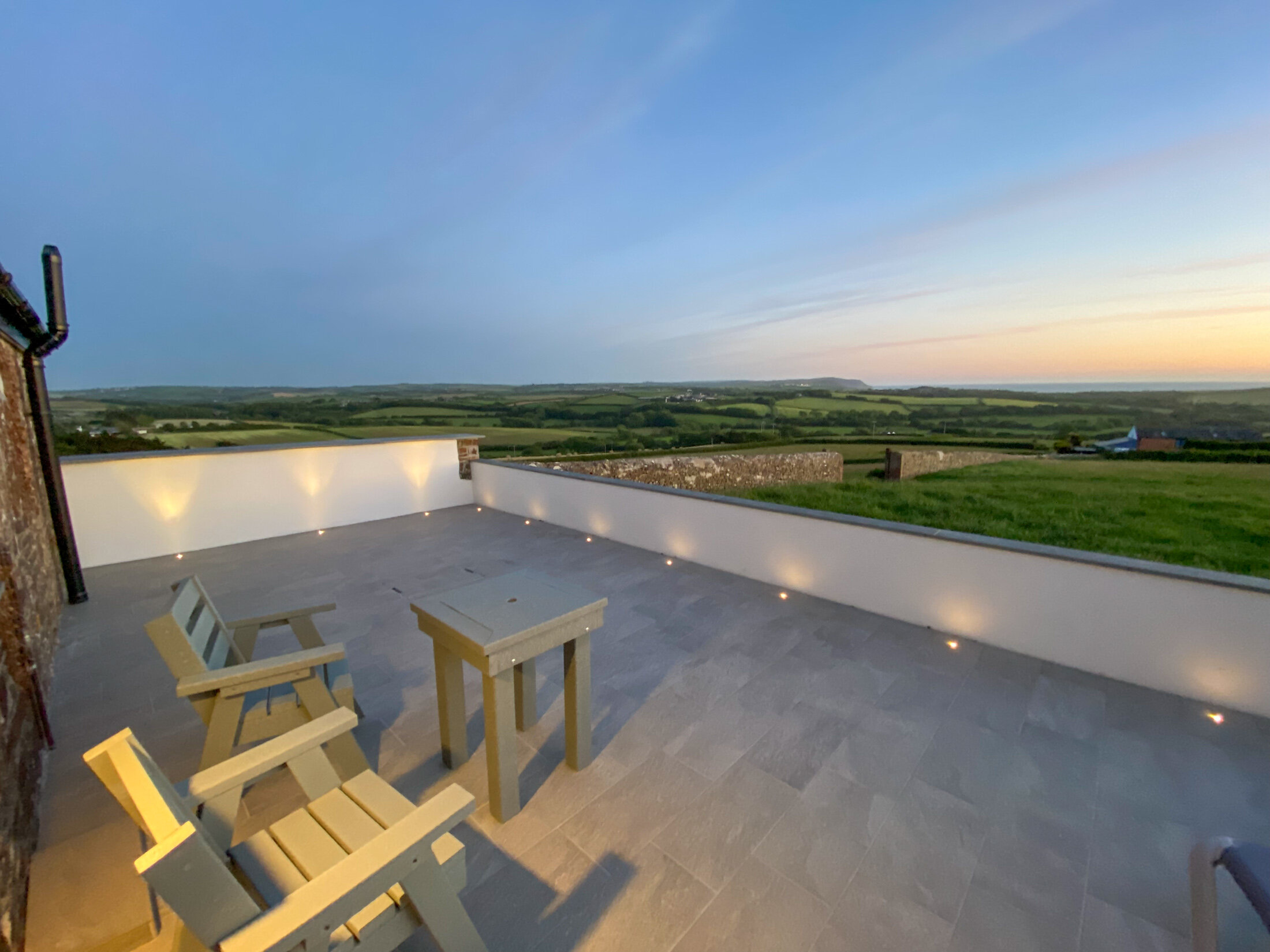 Private patio with sunset views over Widemouth Bay