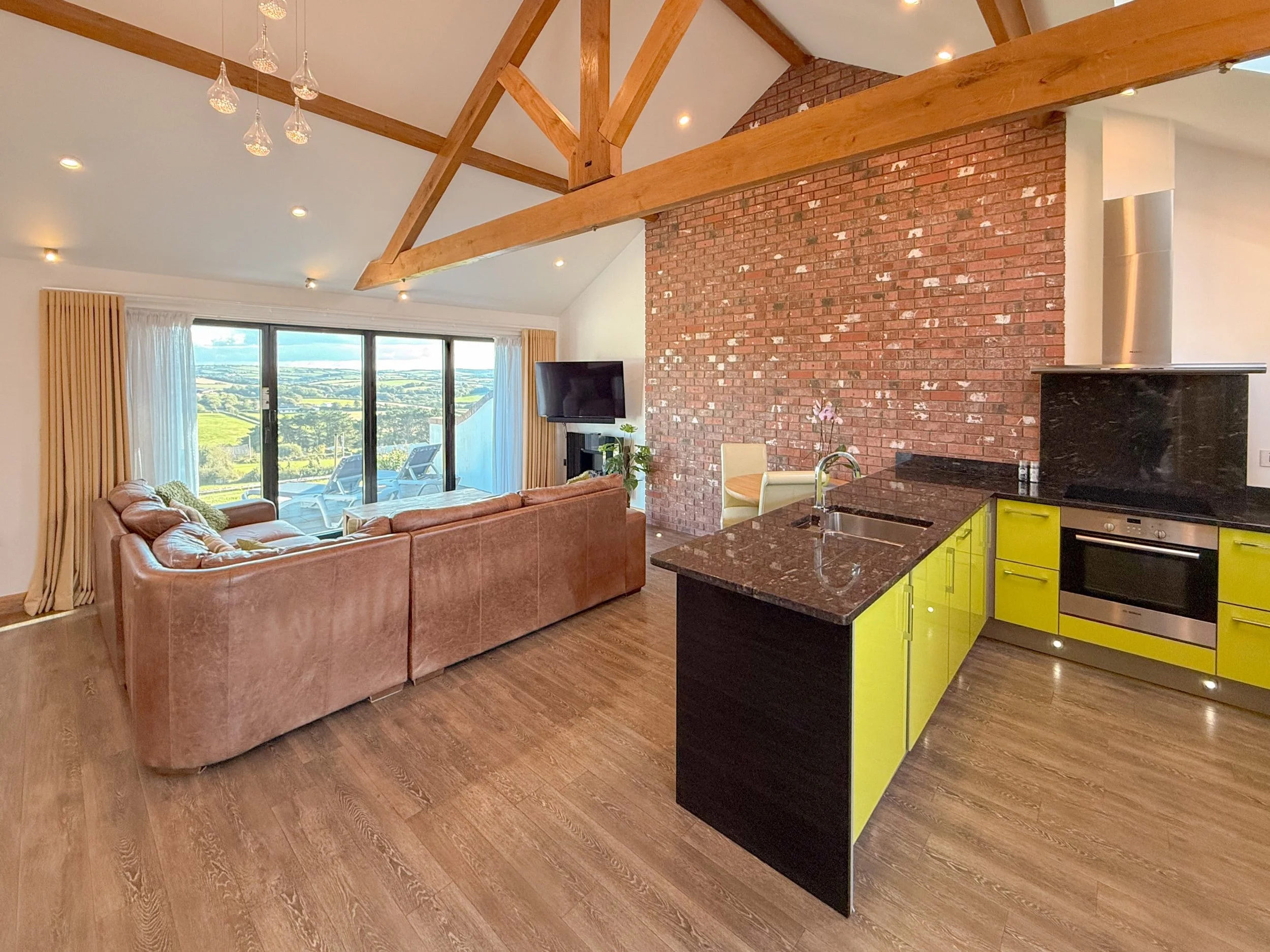 Dining area for two and living area with corner sofa