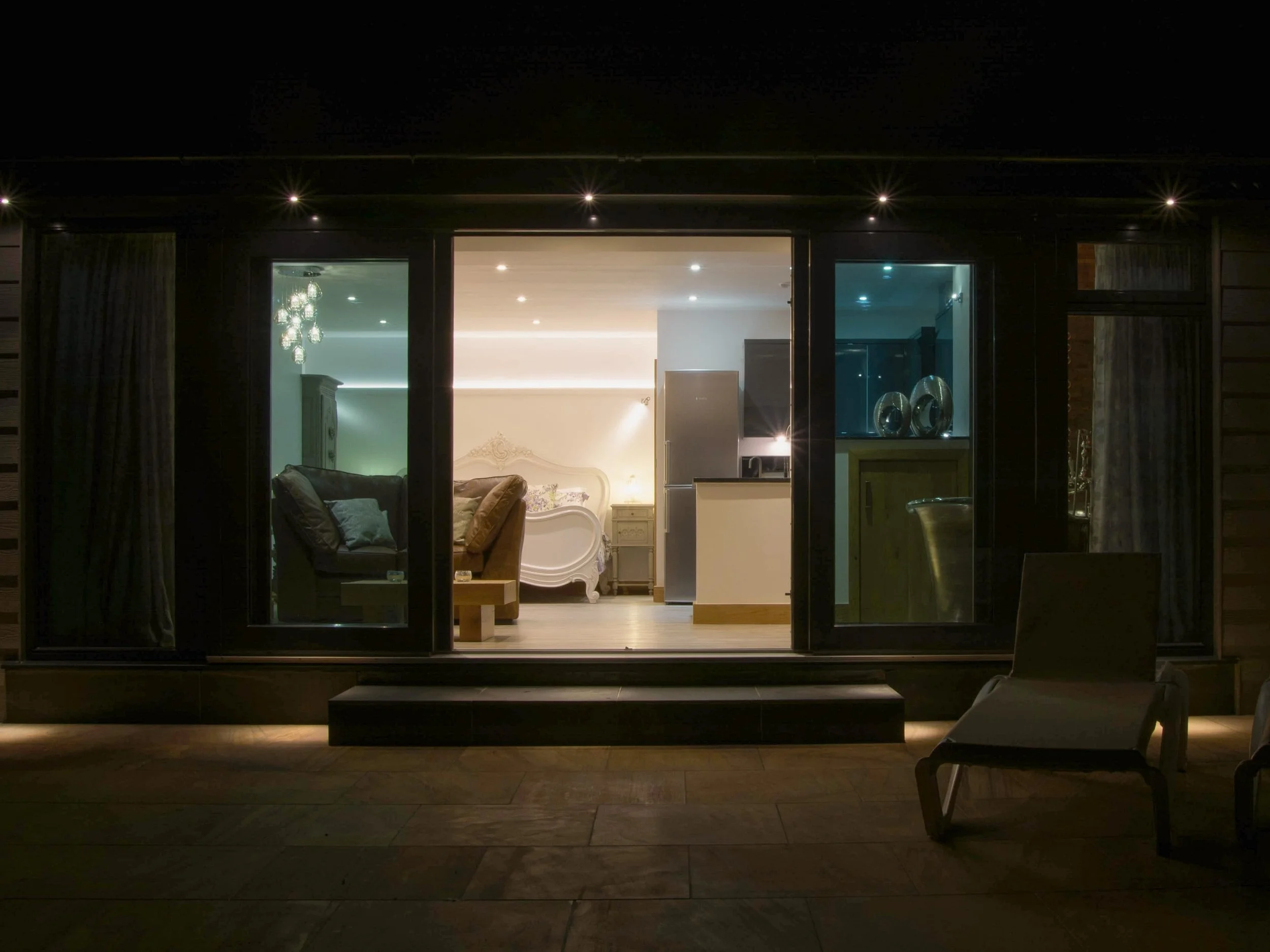 Bijou patio sliding doors at night