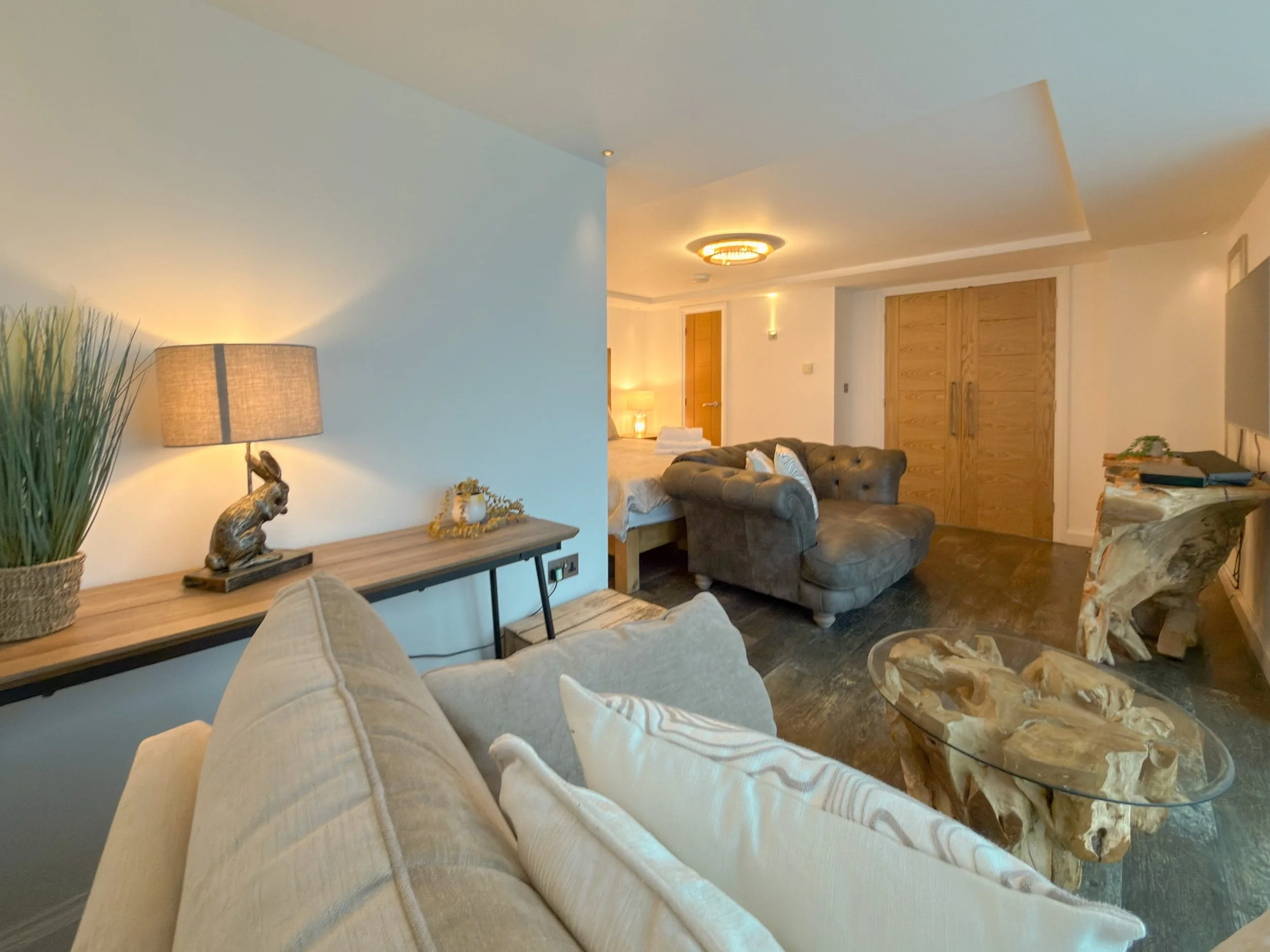 Living area with leather sofa and single chair