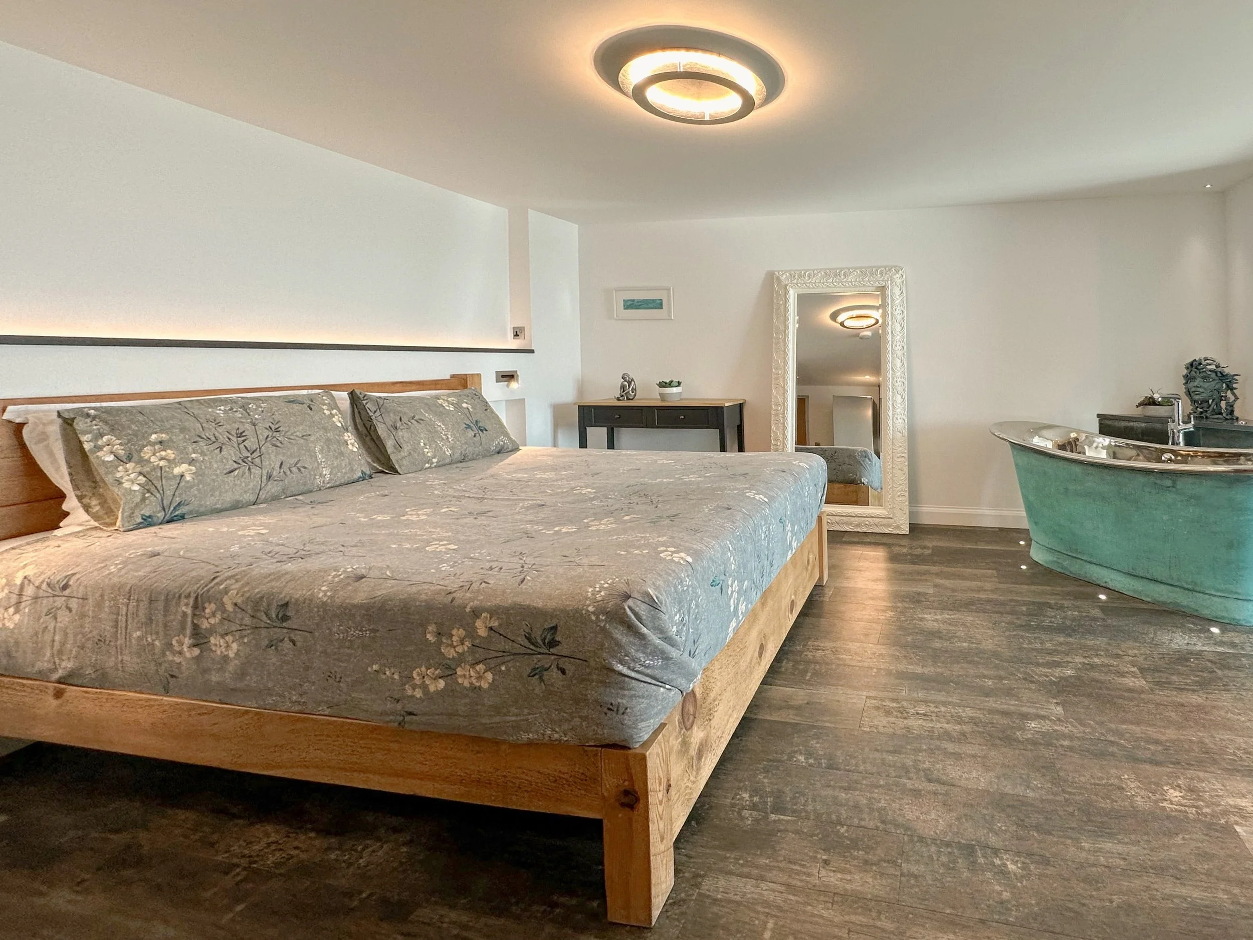 Verdigris bateau air-spa bath in the open plan apartment of Silver Sea