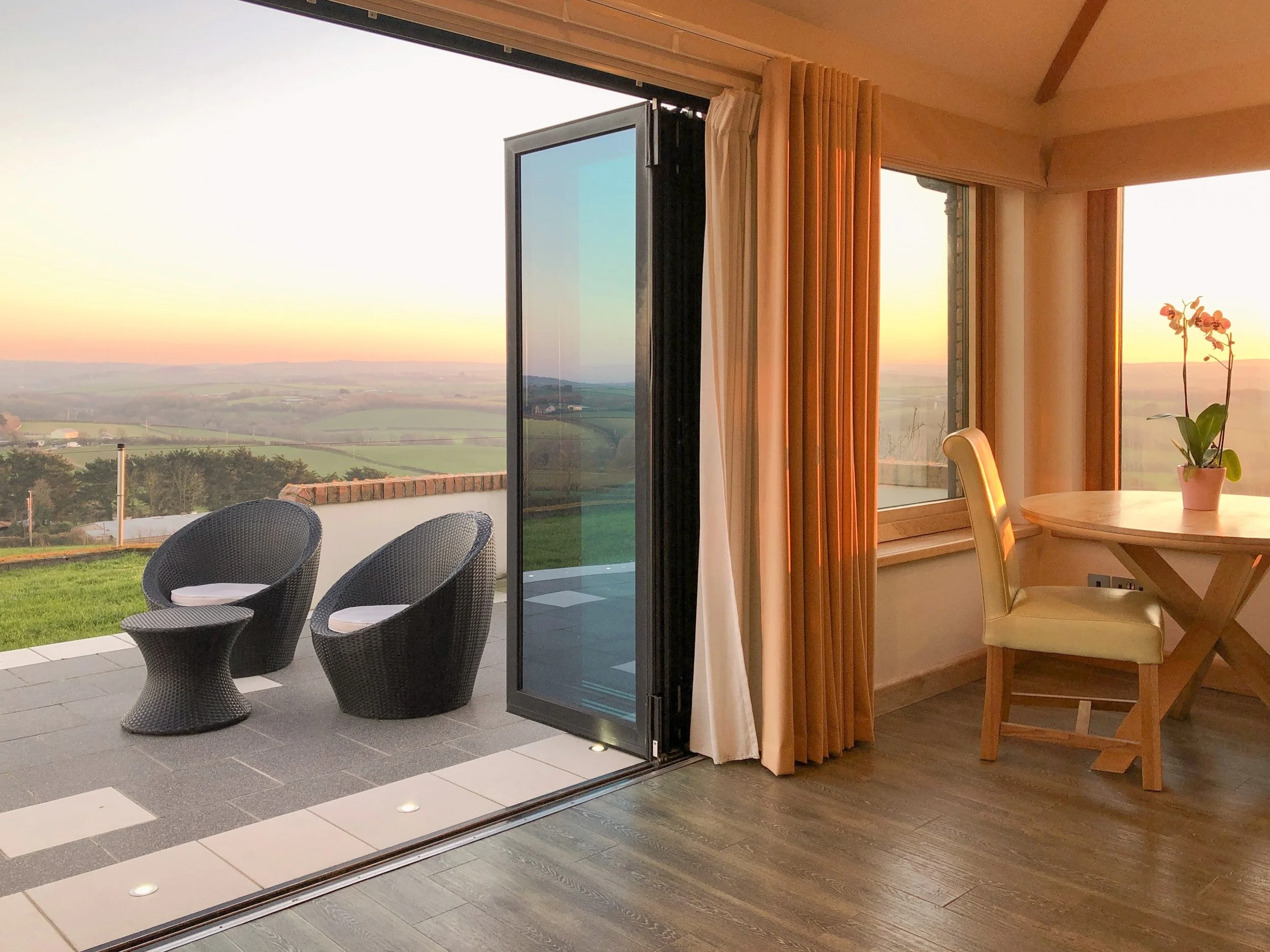 Private patio area with countryside valley views and sea view