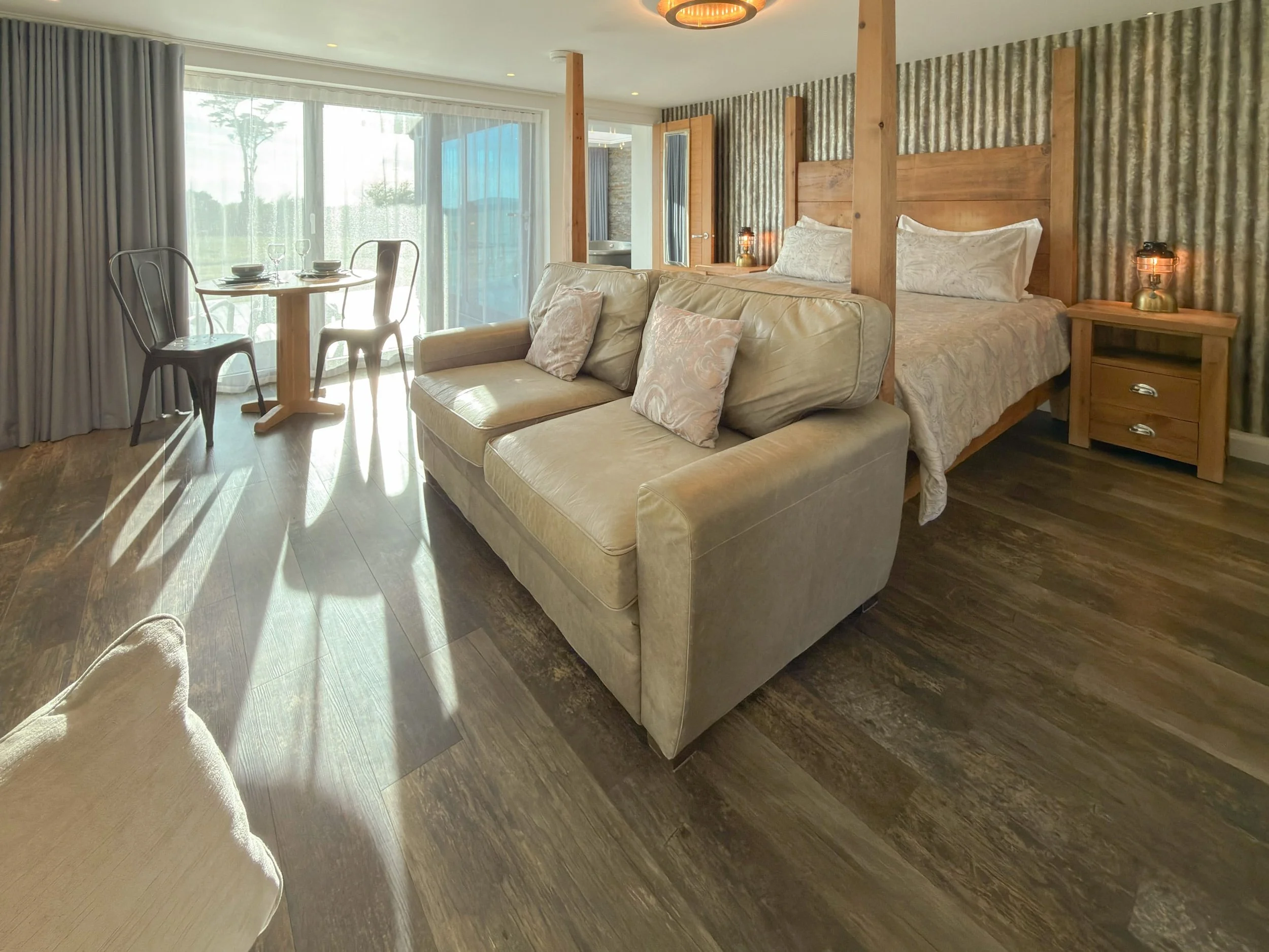 Four poster bed and living area in Sun Seeker