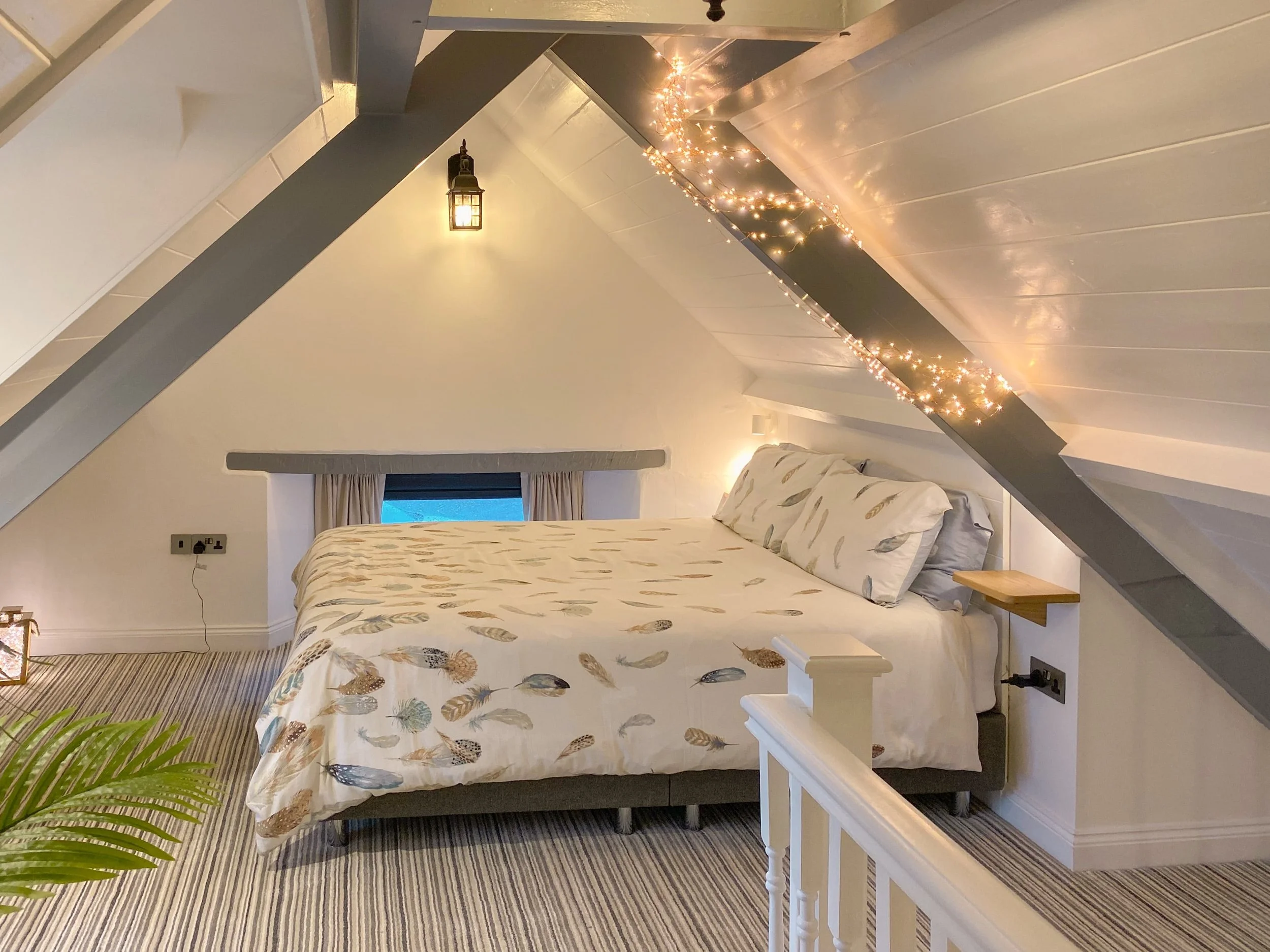 Dreamcatcher bedroom with fairy lights and sloped ceilings
