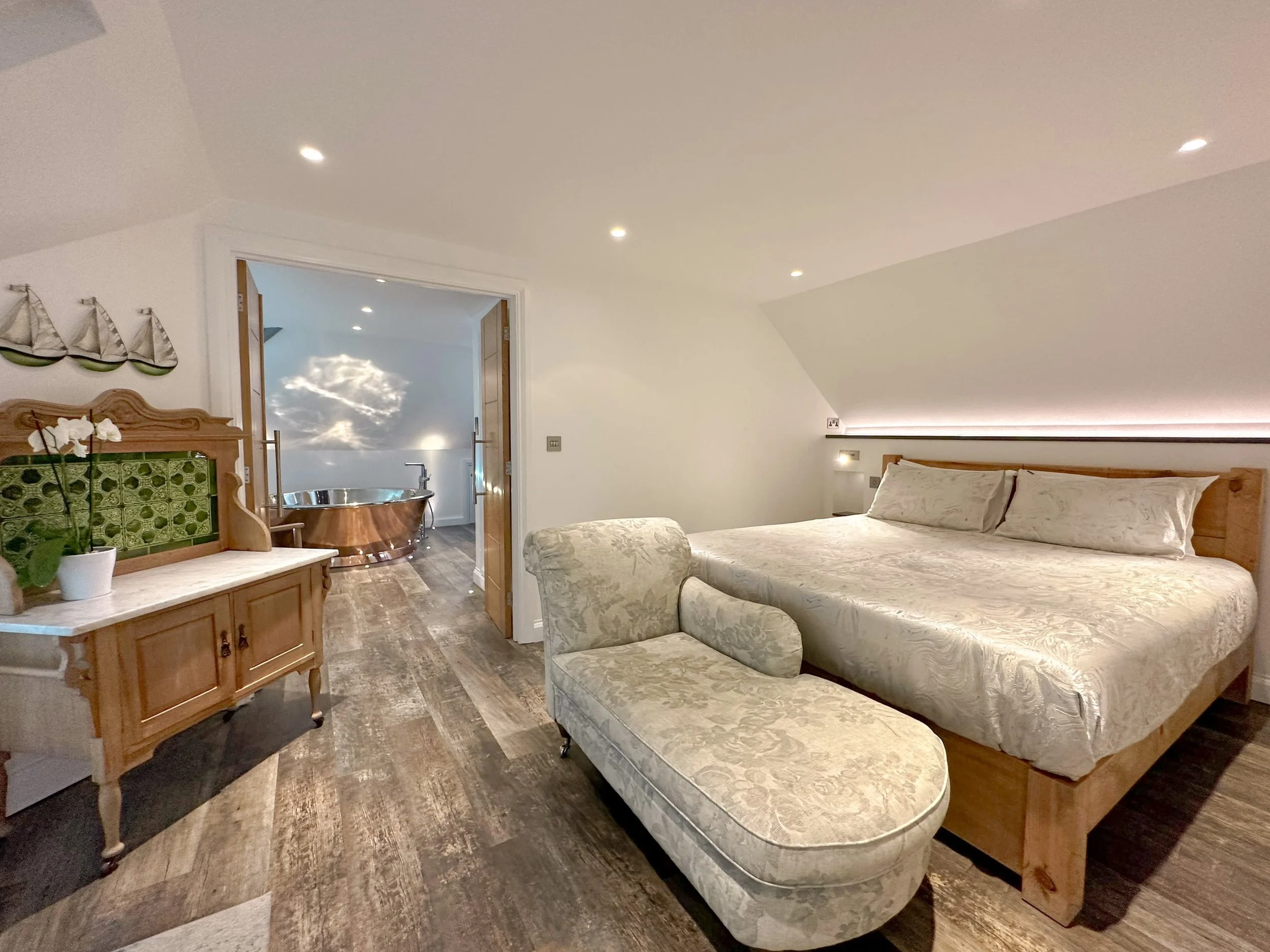 Super-king bedroom with double doors into private copper air-spa bathroom