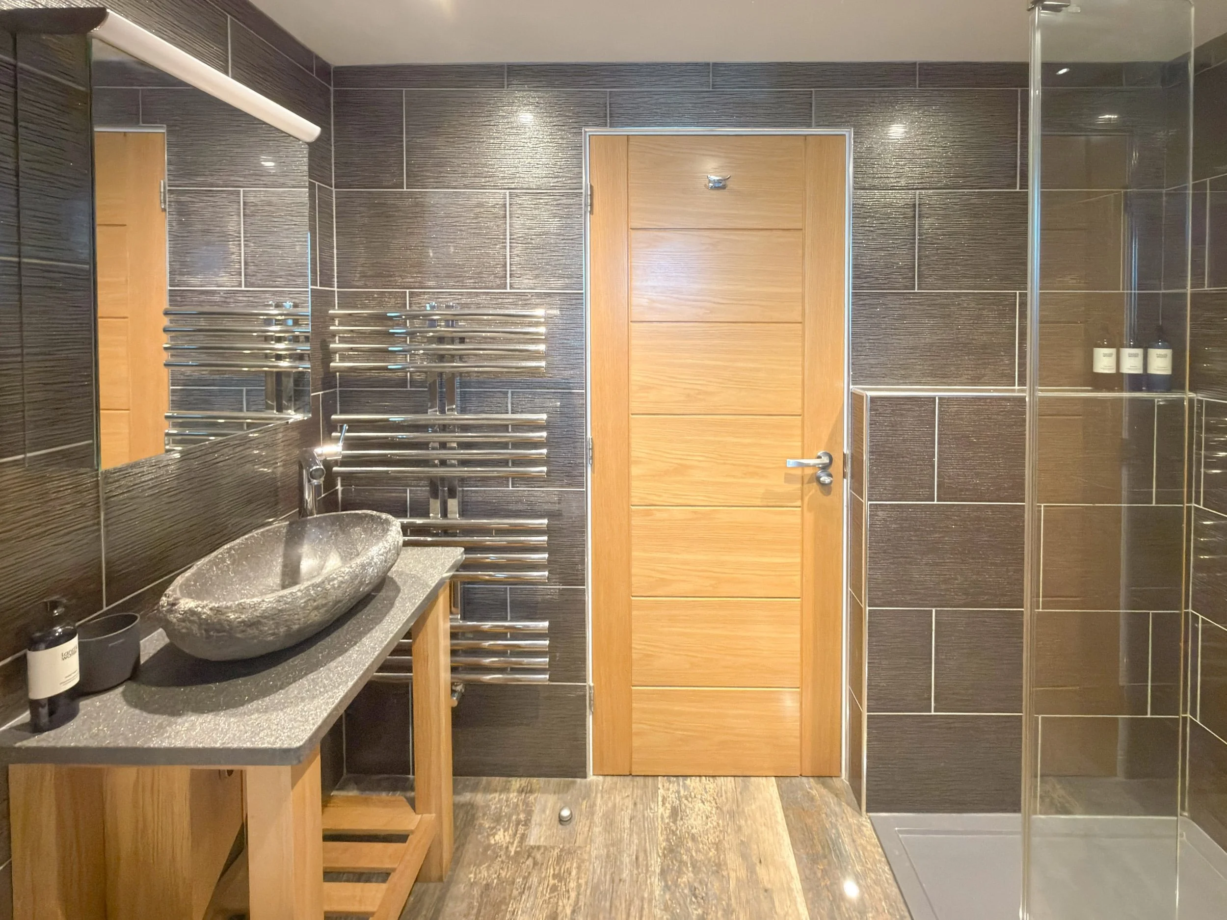 Shower room with river stone basin and walk-in shower