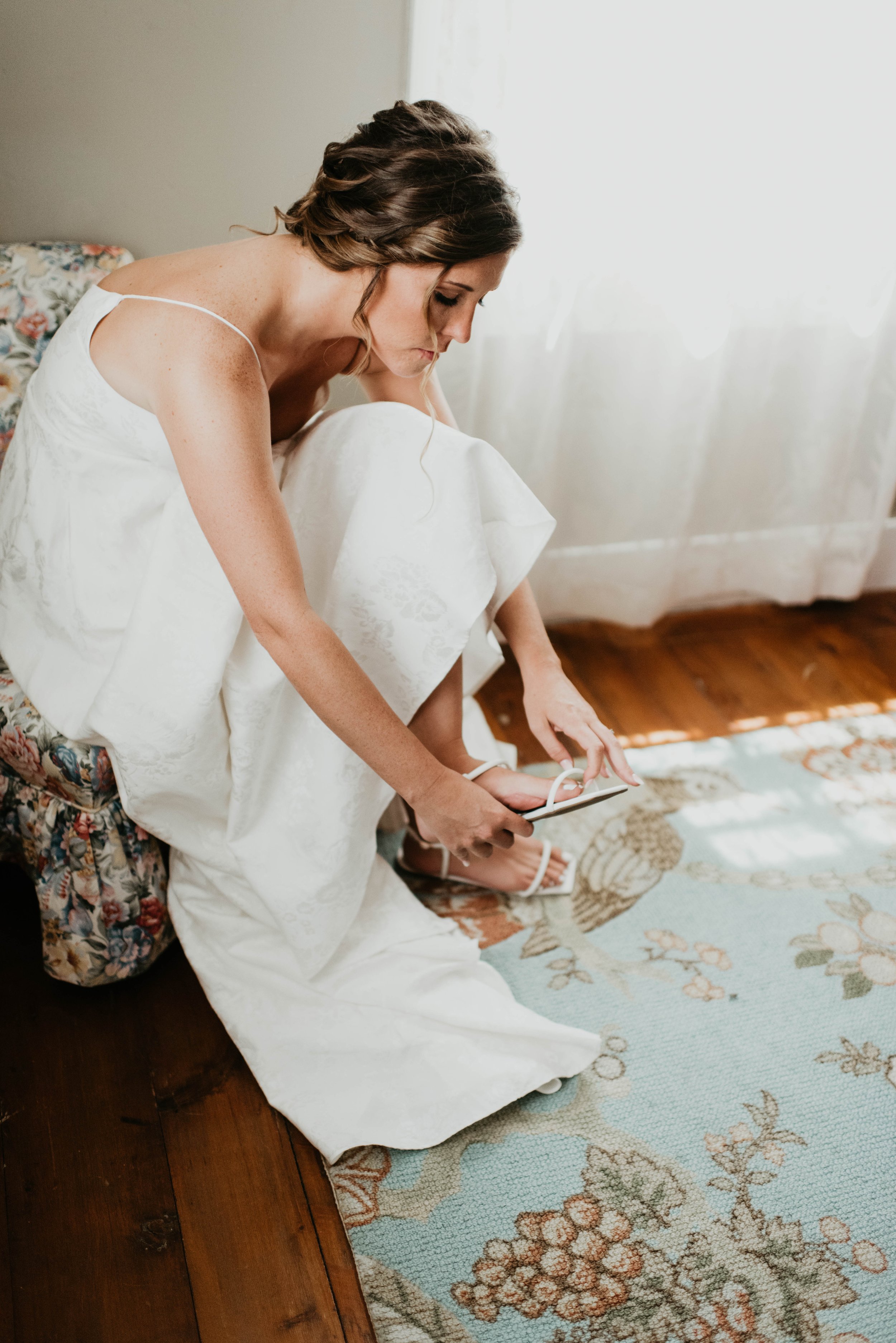 Bride putting on shoes | Bridal hair | Bridal photography| Tales and Tree Photography.jpg